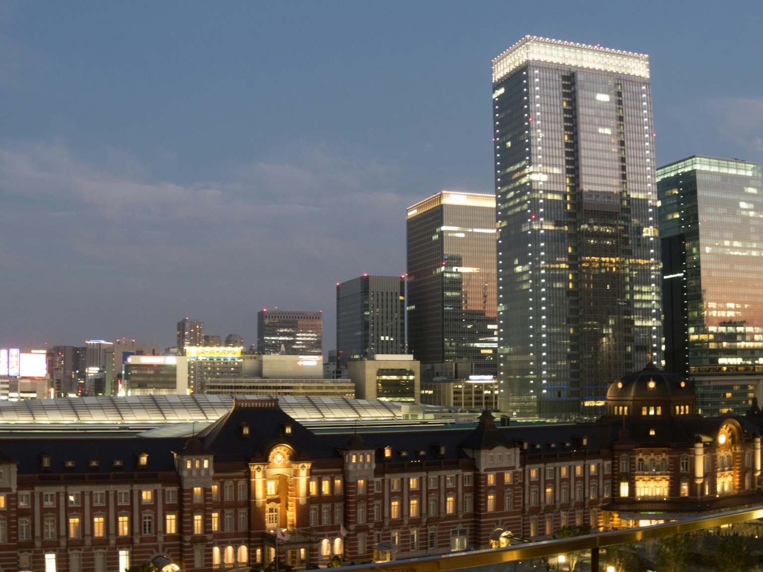 Tokyo Station with skyscrapers at dusk