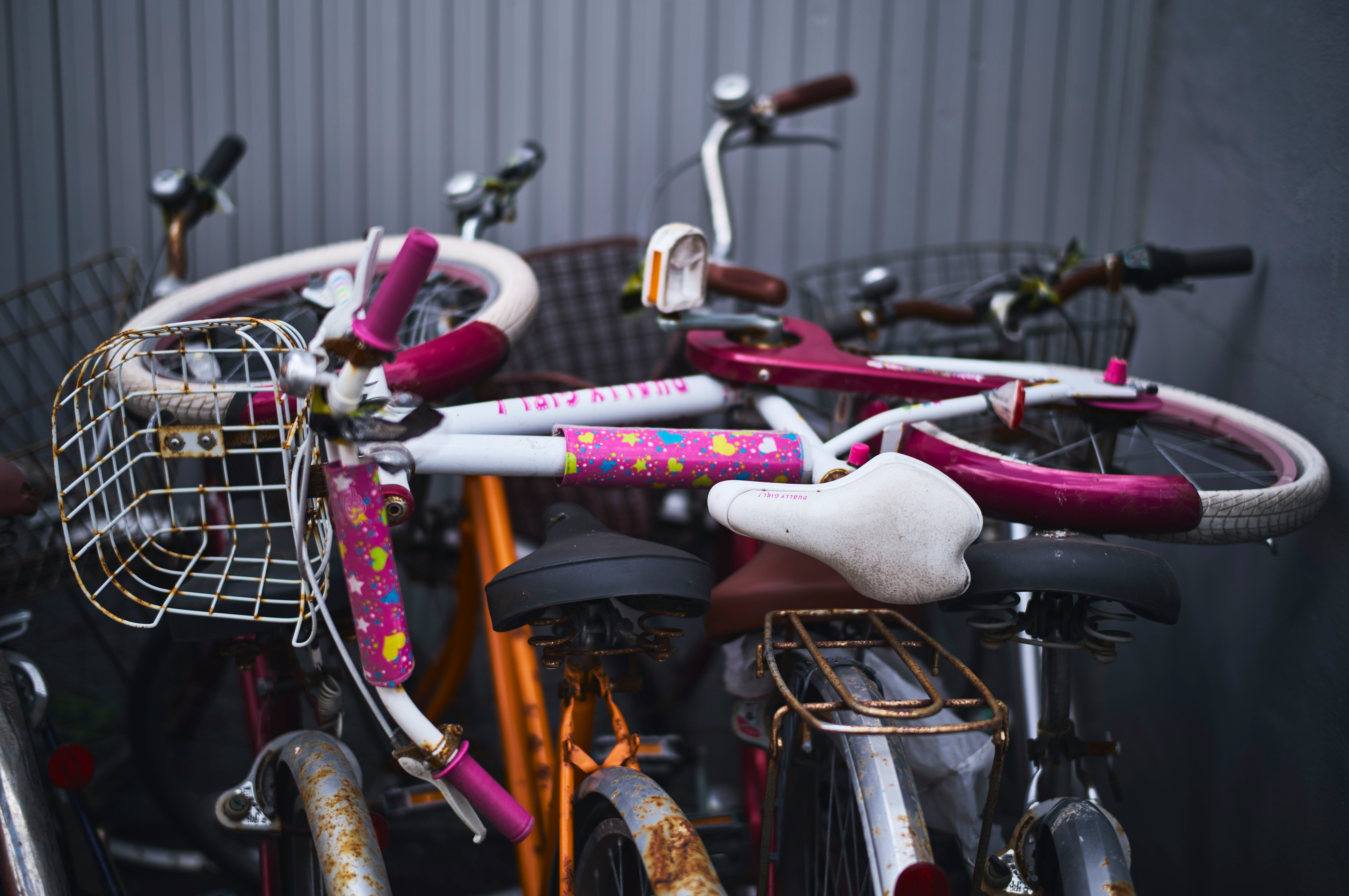 outdoor bike parking with pink bicycles lined up