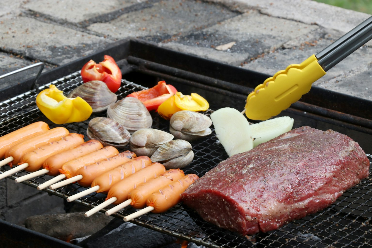 Grilled meat and vegetables on a barbecue