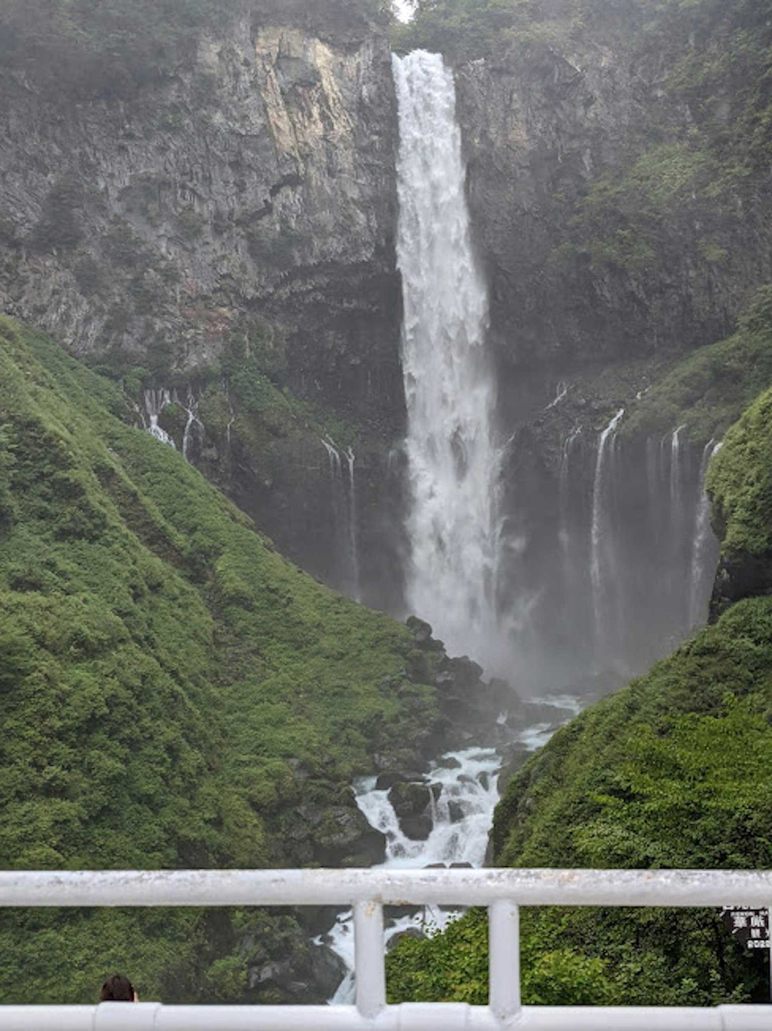 A stunning waterfall surrounded by lush green mountains