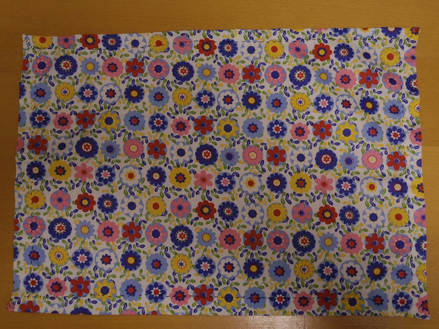 Colorful floral patterned fabric laid out