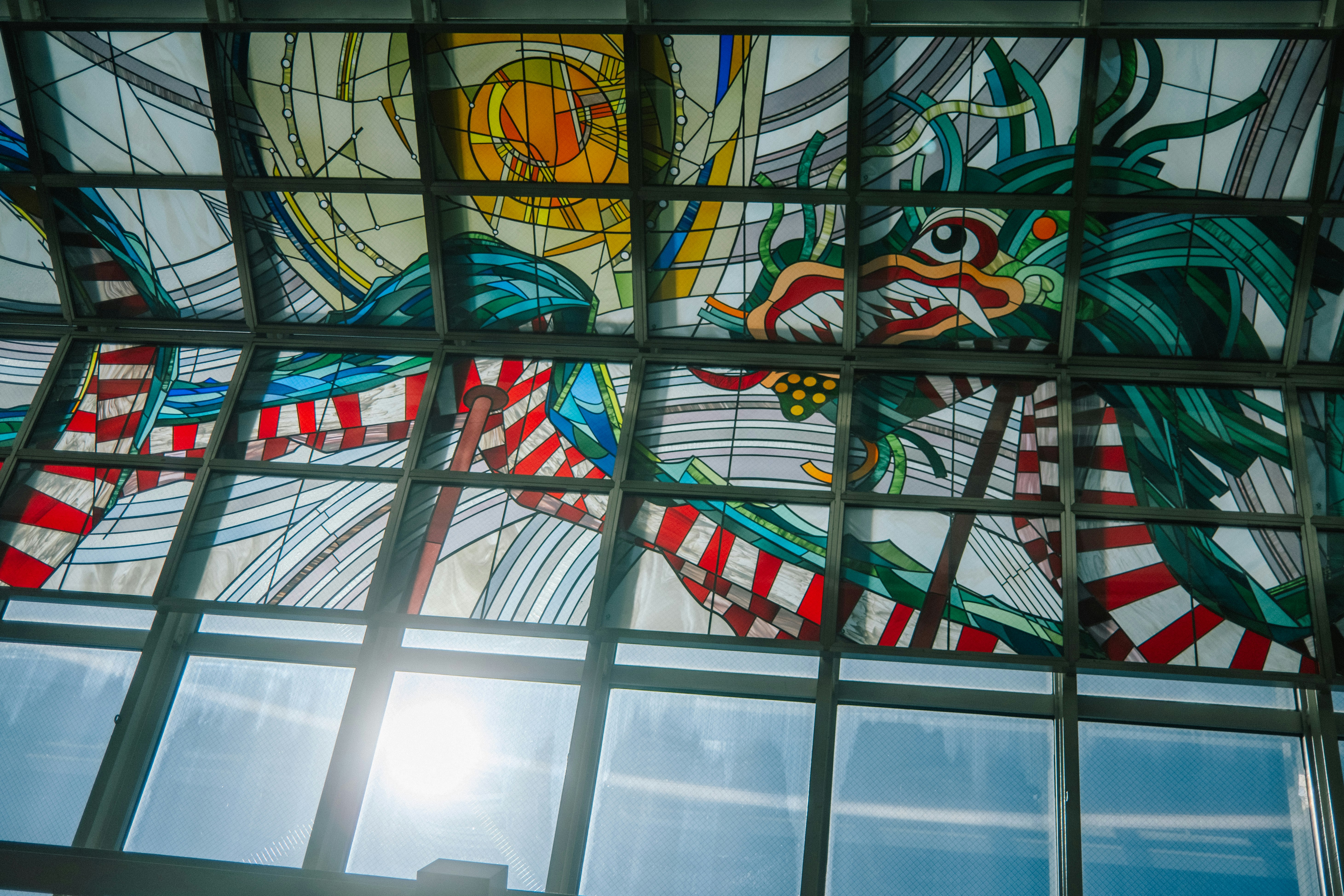 stained-glass style geometric patterns on a glass ceiling