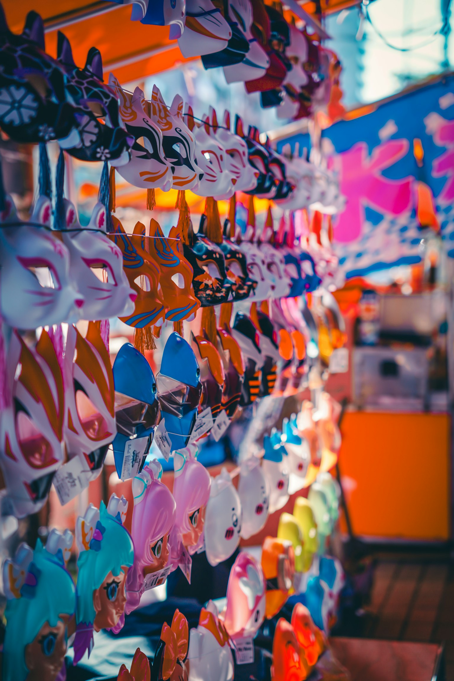 Colorful masks displayed at a vibrant market stall
