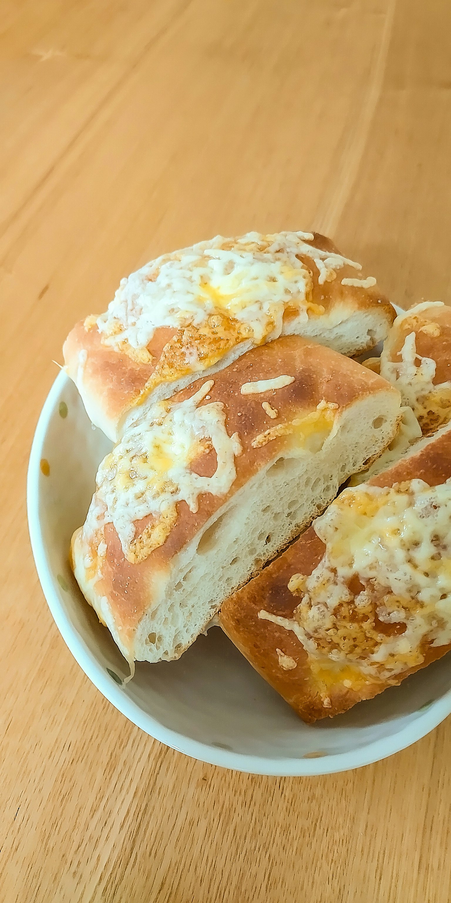 Freshly baked bread arranged on a white plate