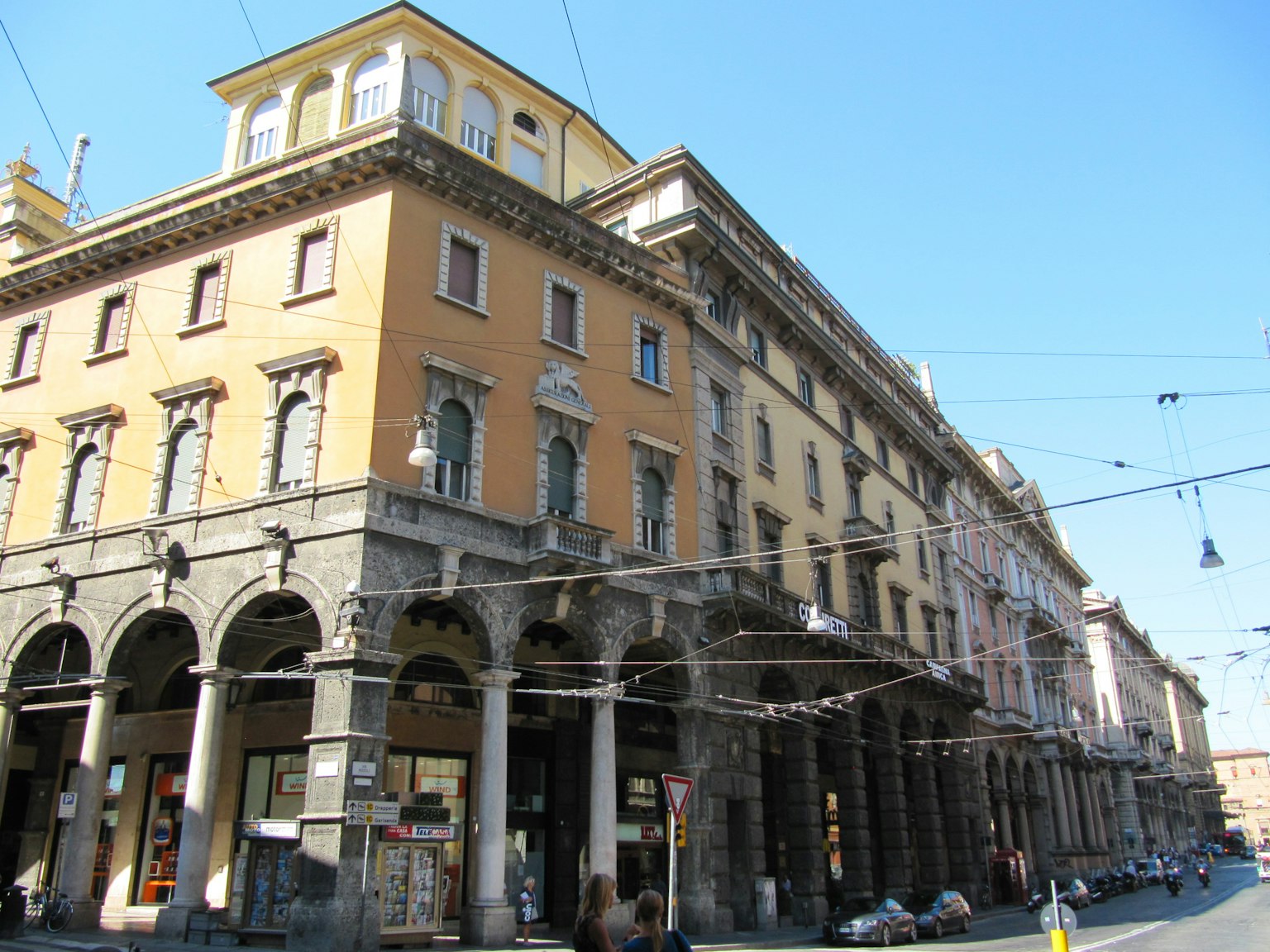 Historic buildings with arches and balconies in an urban setting