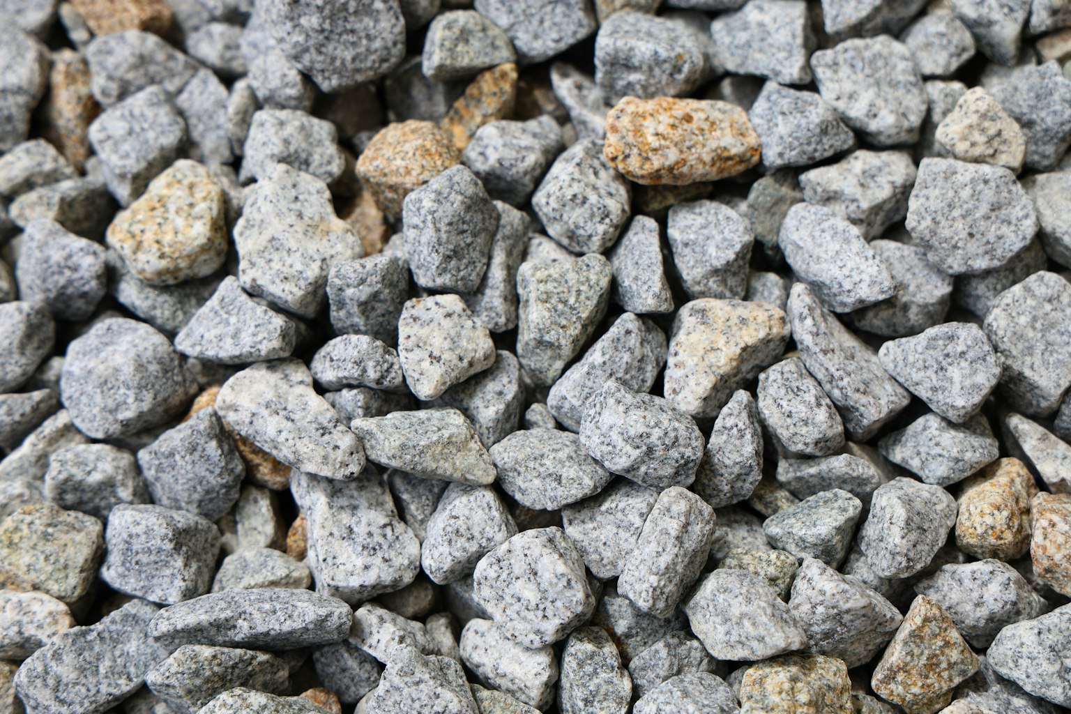 Various sizes of gray stones scattered on the surface