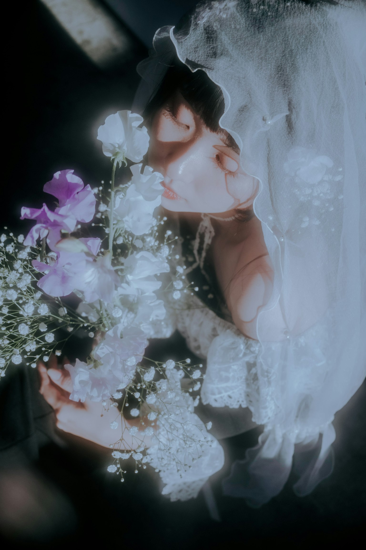 Soft portrait of a bride holding a bouquet