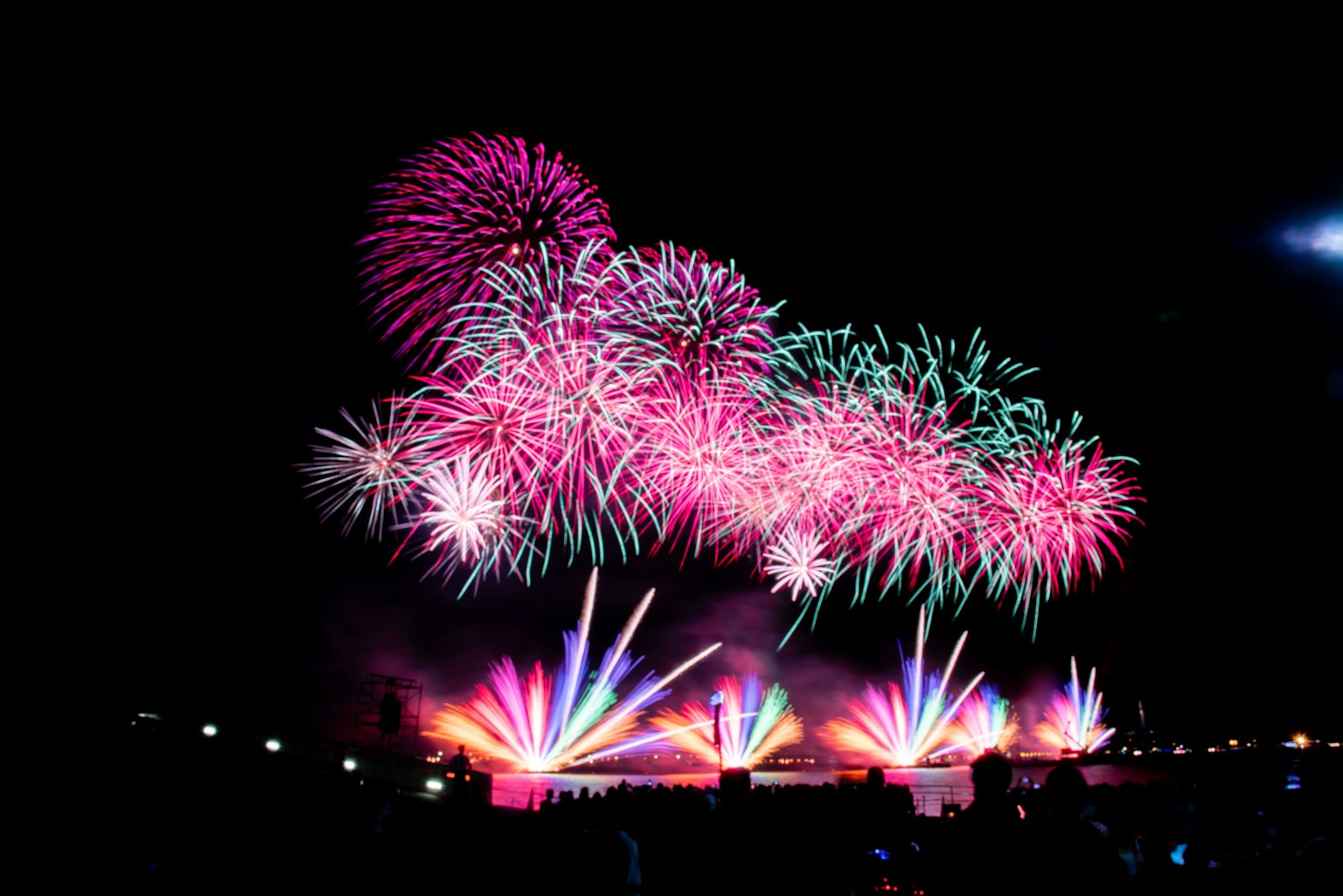 Colorful fireworks and light fountains in the night sky