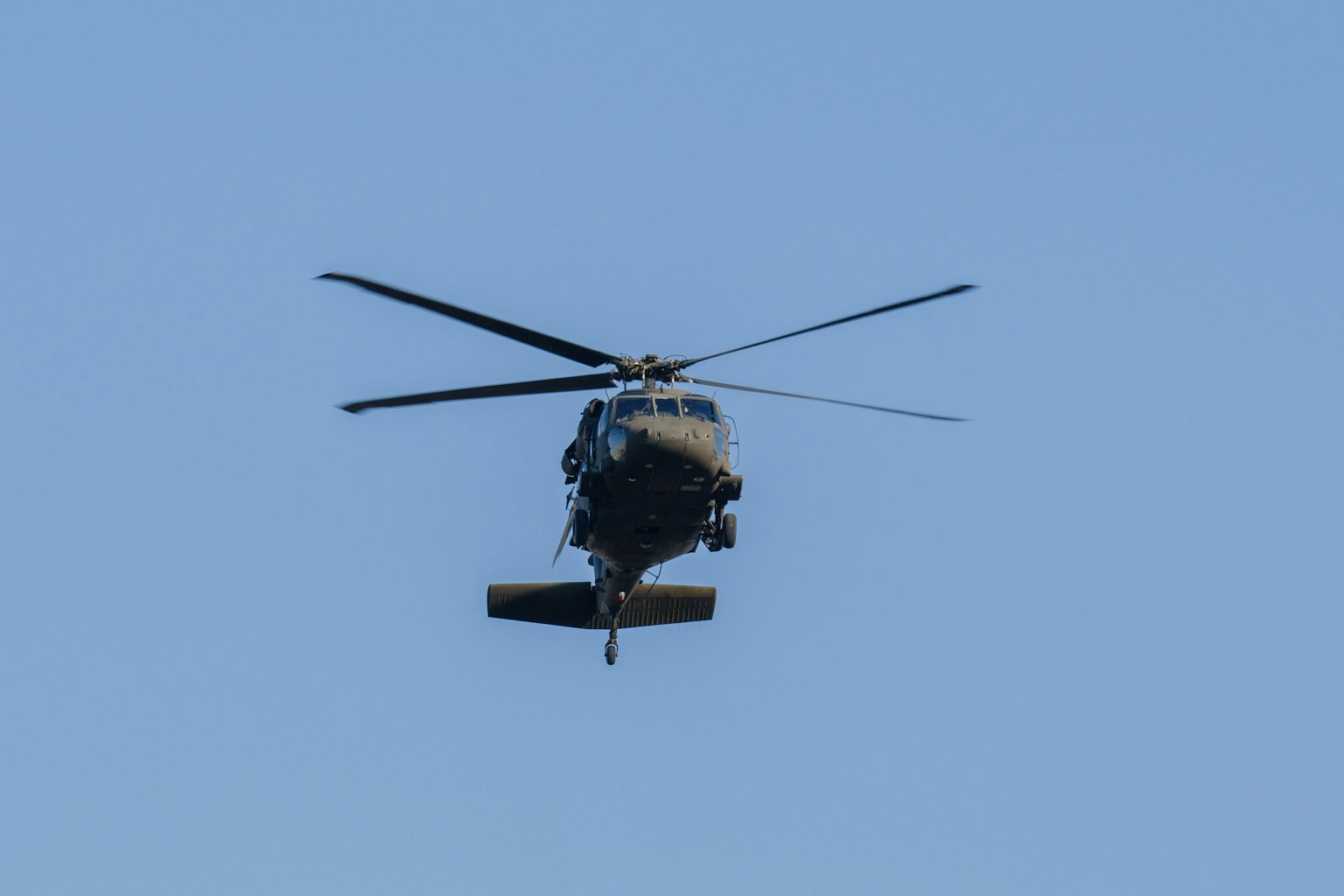Front view of a helicopter flying in the sky