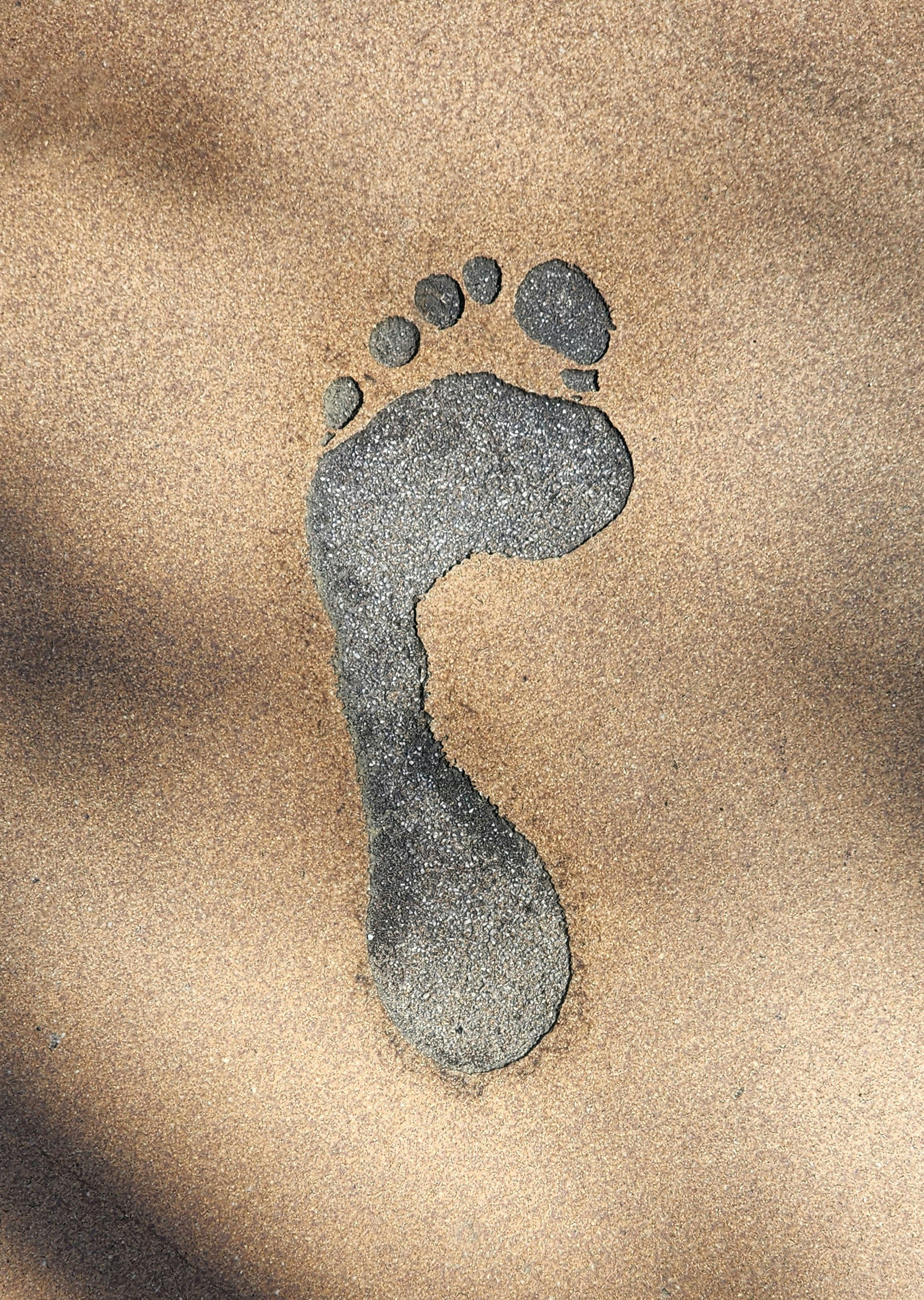 沙地上像腳印的影子藝術