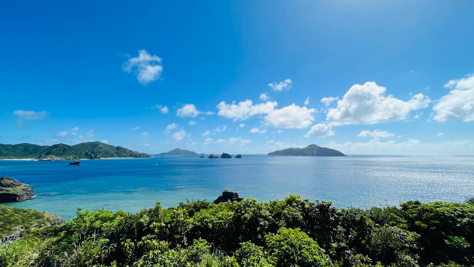 Beautiful view of blue sea and sky with islands and green vegetation