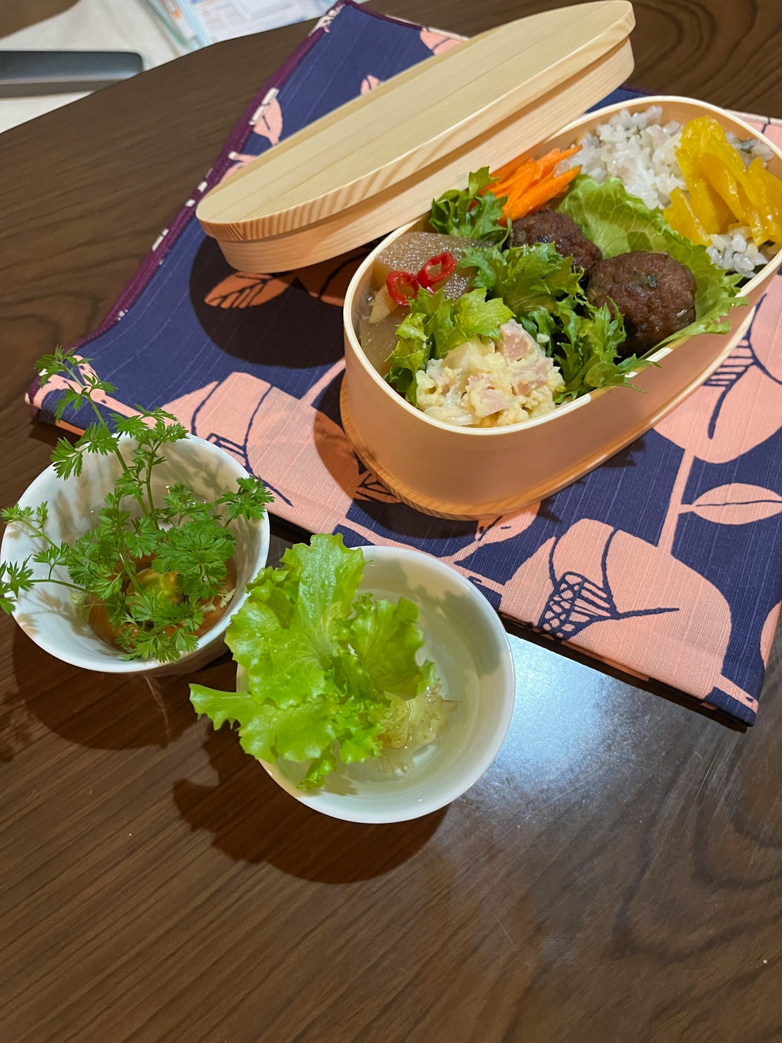 Stylish bento box filled with colorful vegetables and rice