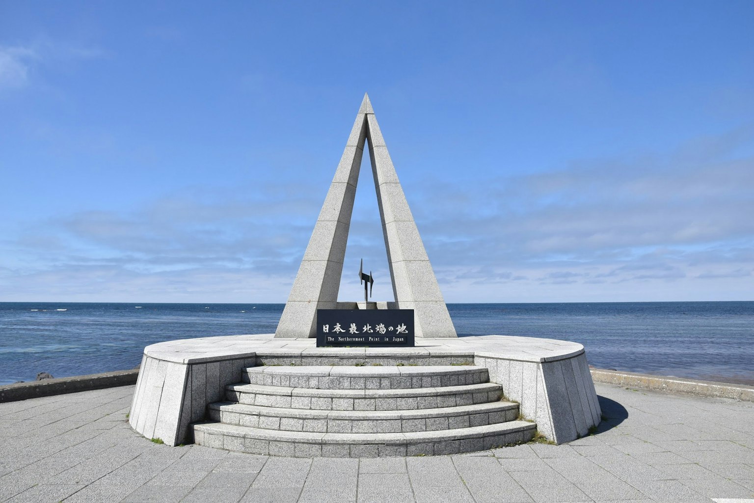 Triangular monument with steps near the sea