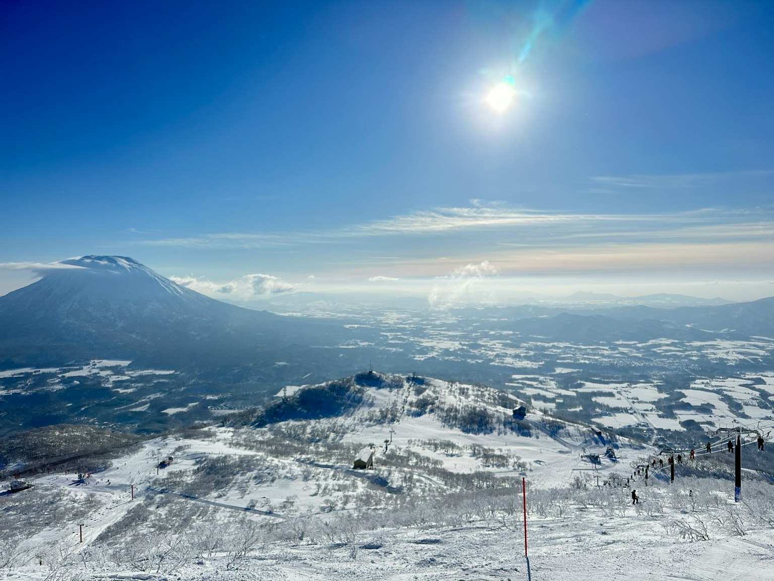 Beautiful snowy landscape with mountain view under blue sky