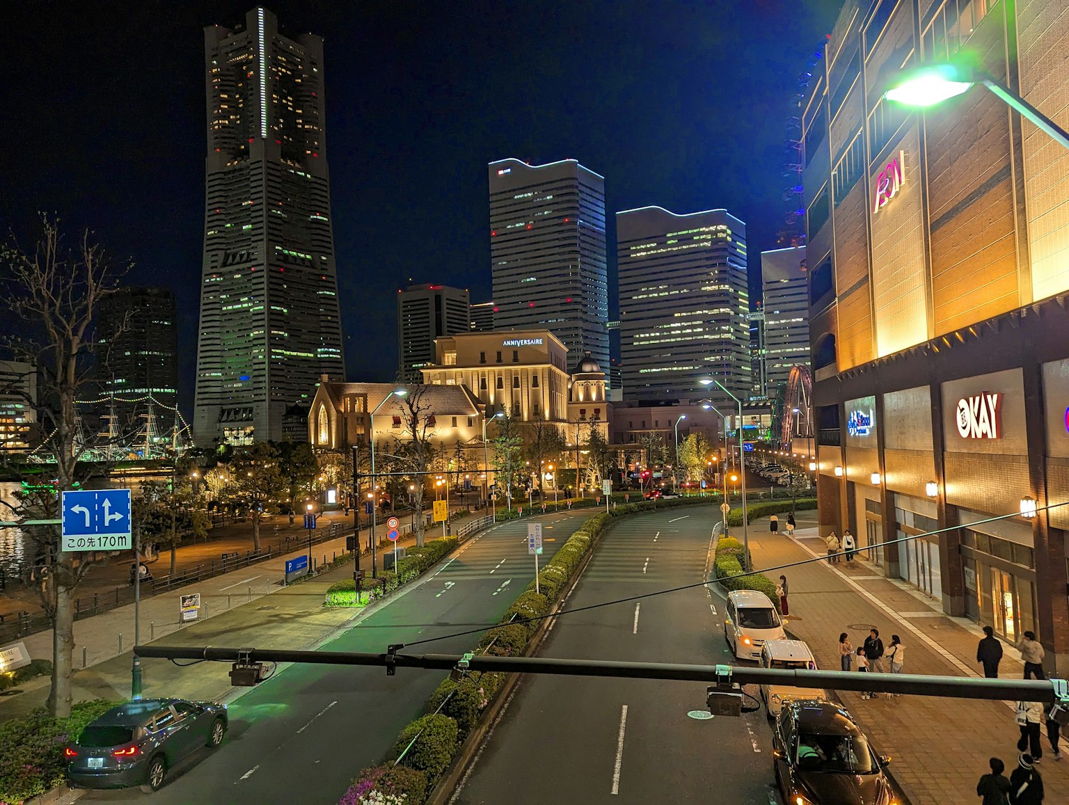 Night cityscape with illuminated skyscrapers and street lights
