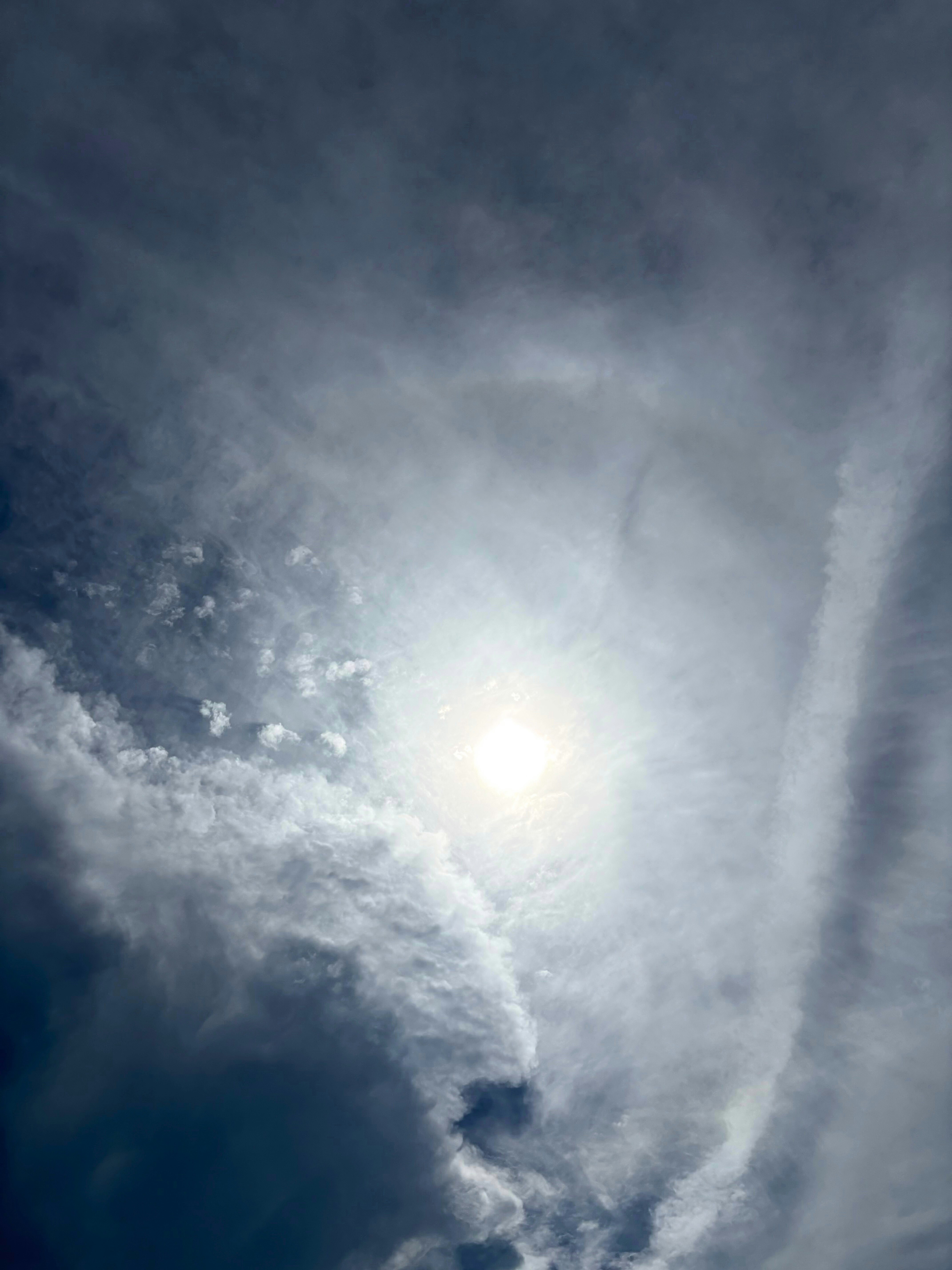 sunlight breaking through clouds in the sky
