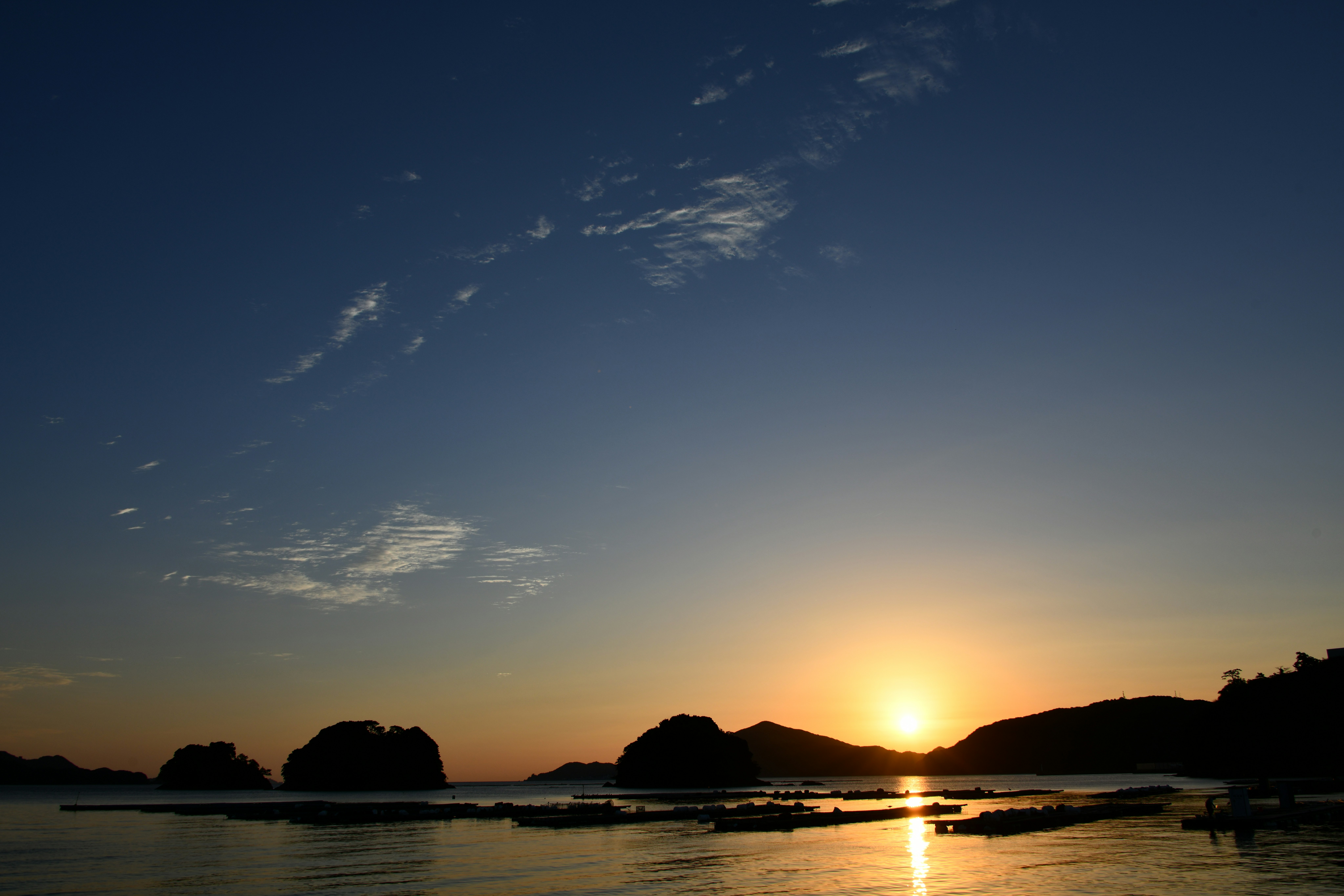 A tranquil seaside landscape at sunset