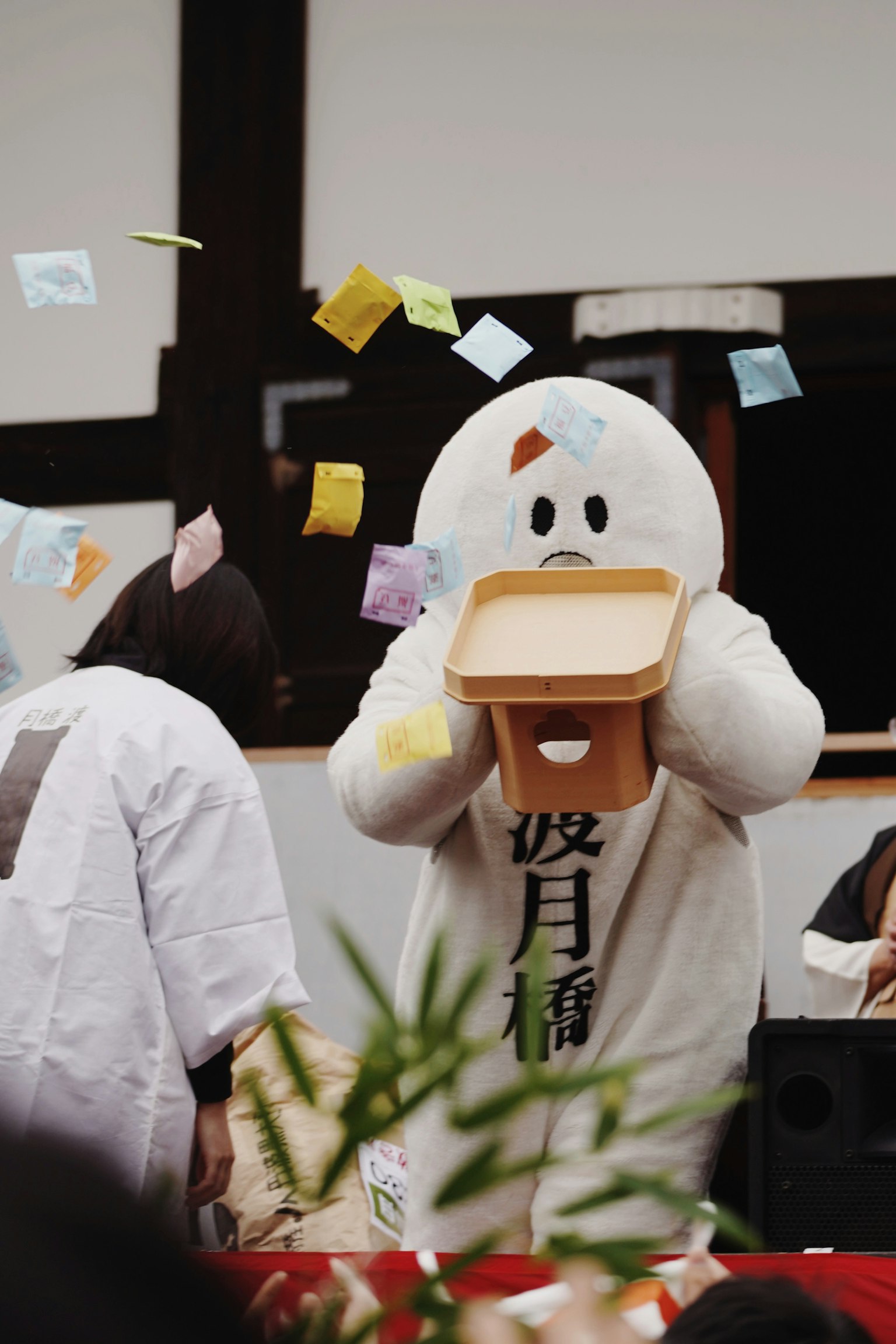 Participant in a white duck costume at a festival