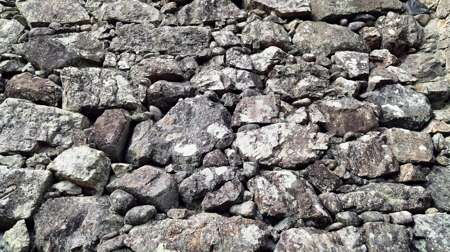 Surface covered with various sizes and colors of rocks