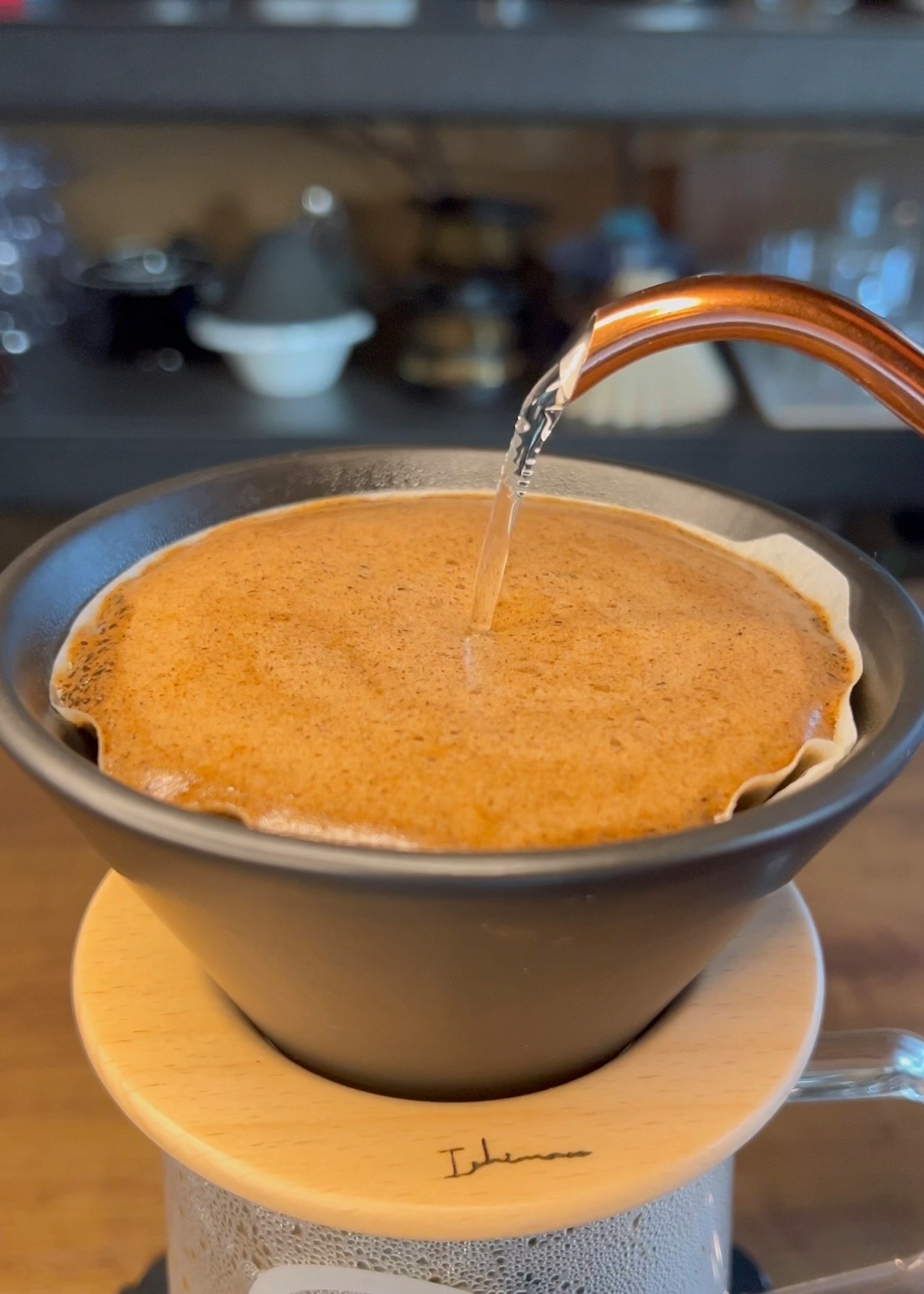 Coffee brewing process with water pouring over a paper filter