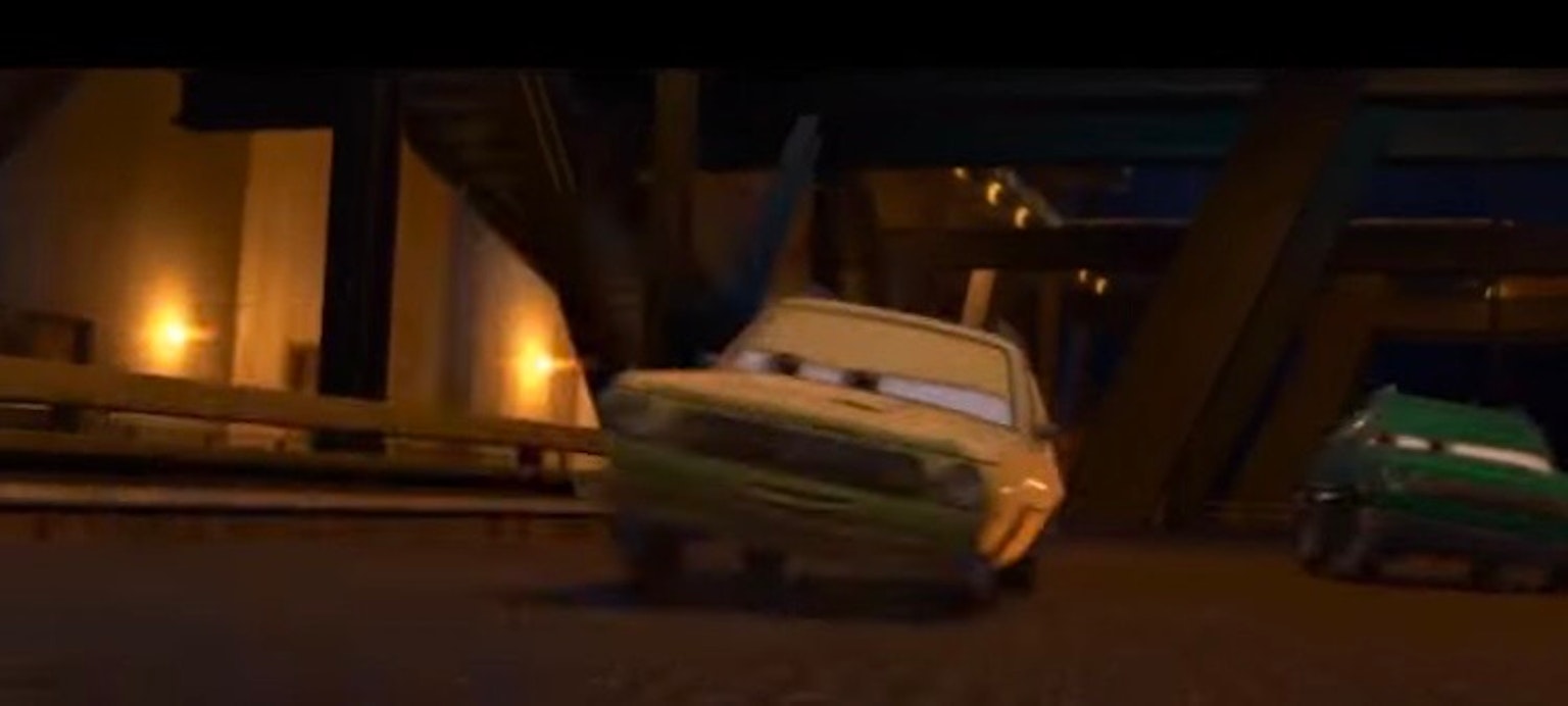 Animated car character from the movie Cars racing through a dark tunnel
