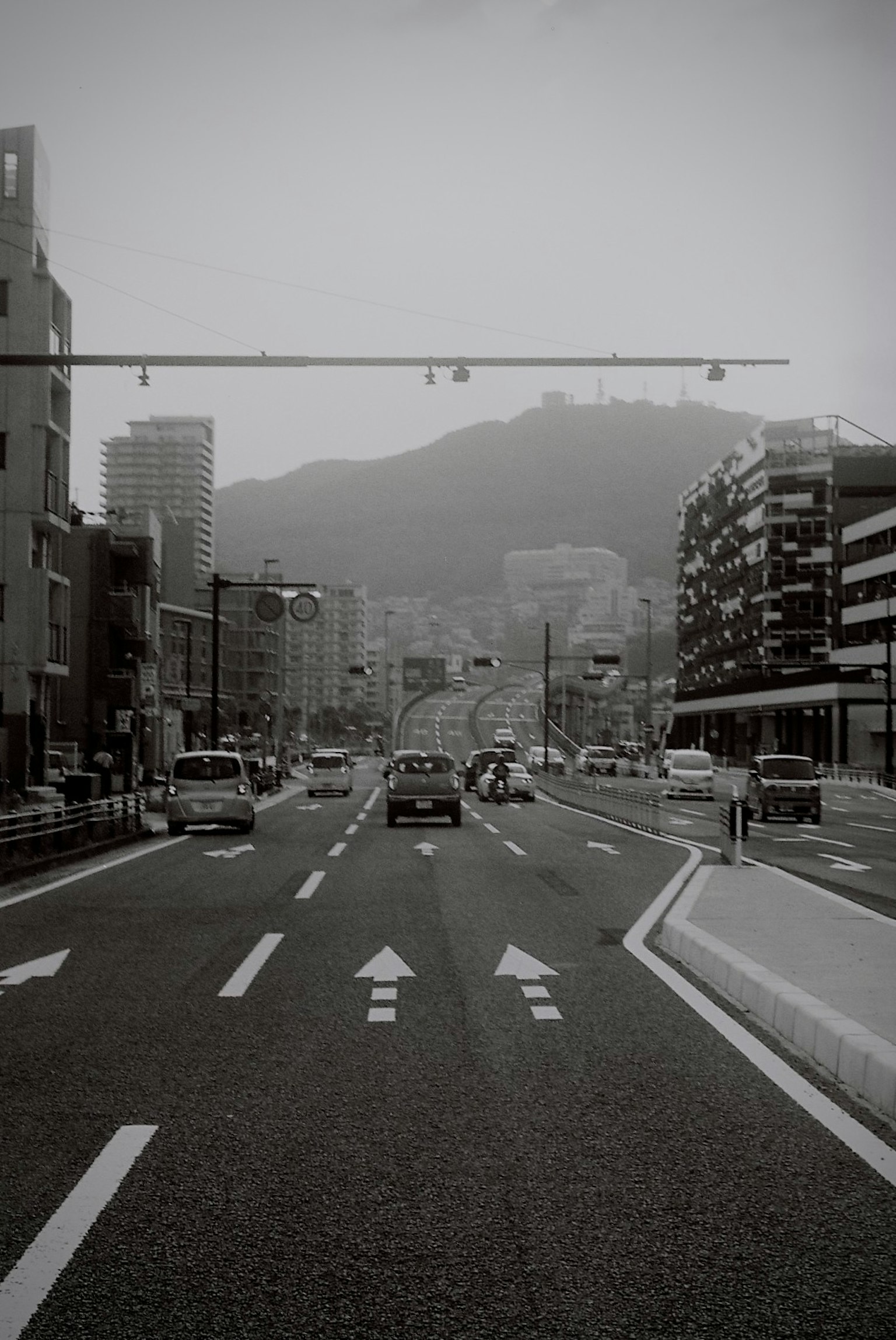 Black and white city road view with buildings