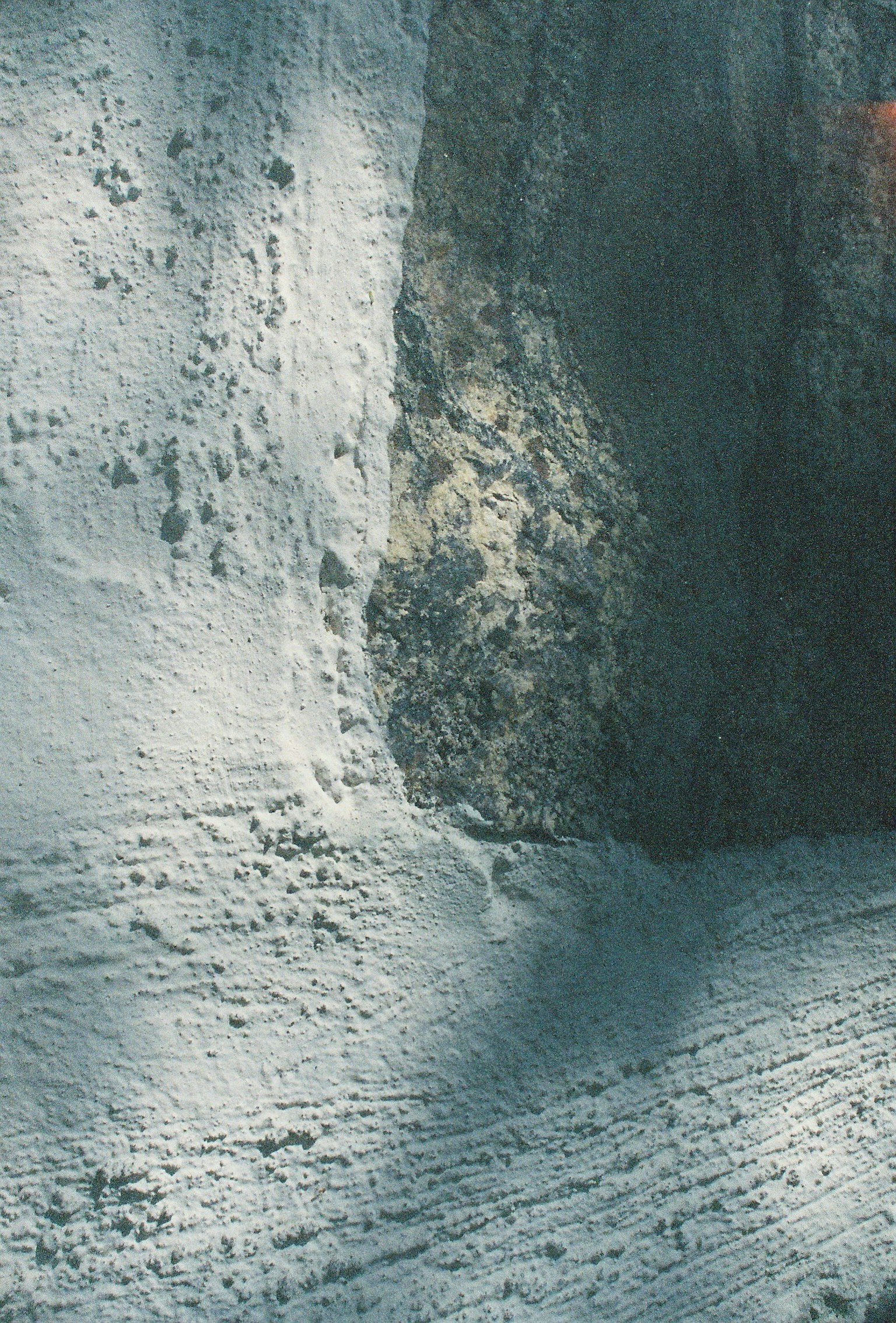 Winter landscape with white snow surface and dark shadows