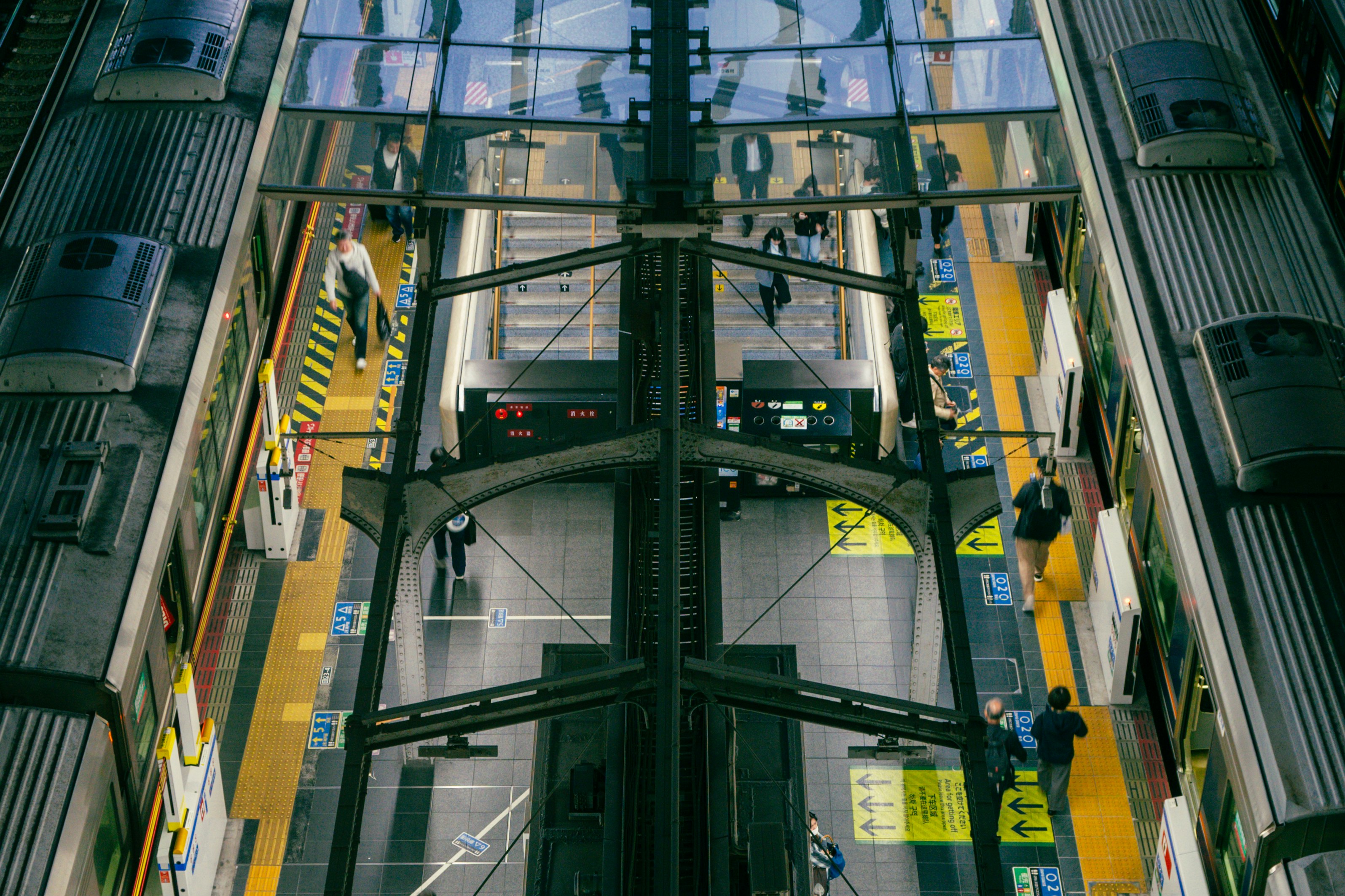 Escalators leading to platforms inside Umeda Station, Osaka