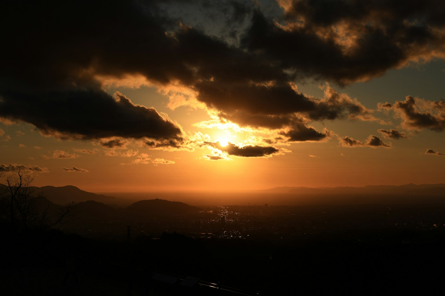 Beautiful landscape with a sunset, clouds scattered, mountains in the background
