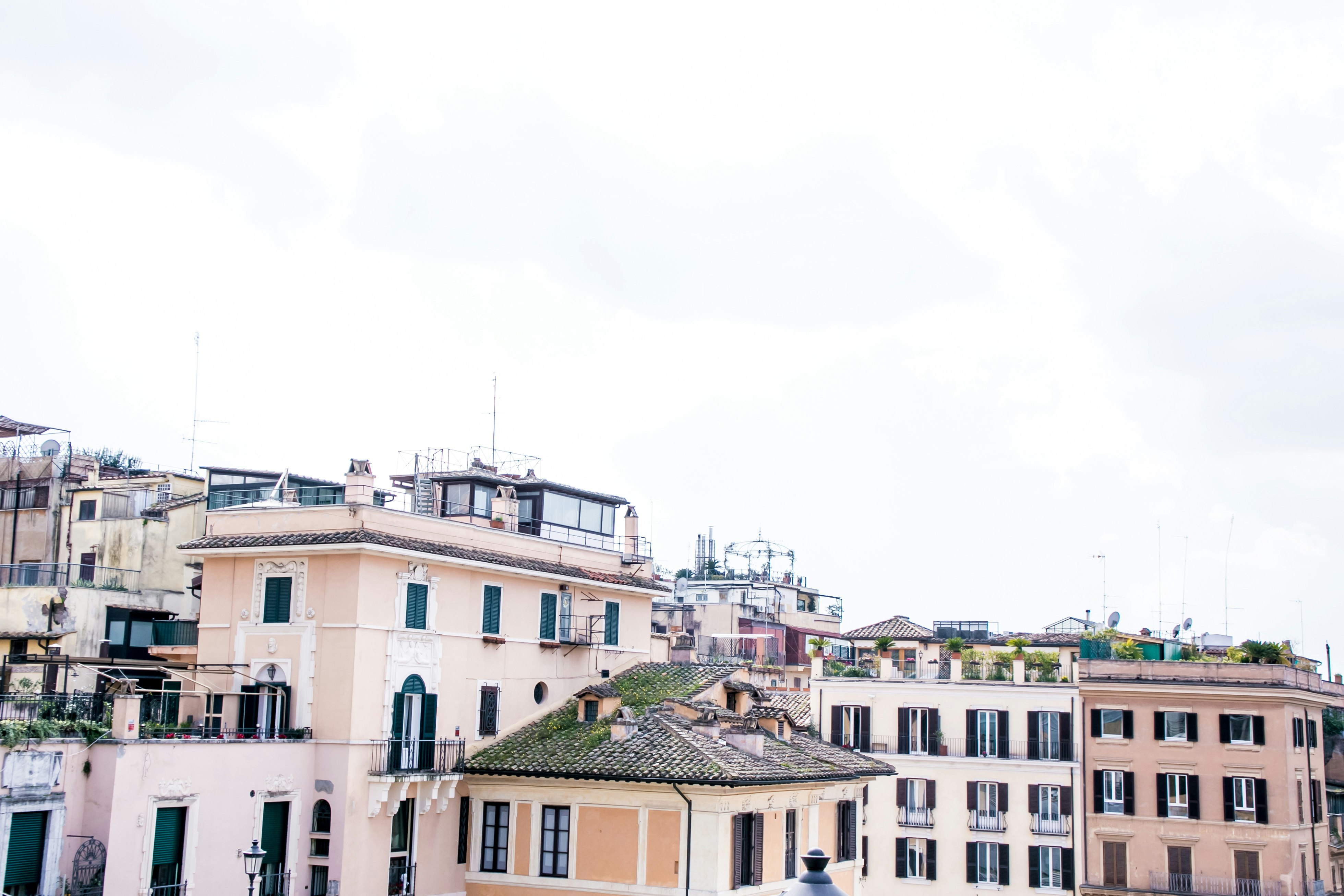 view of rooftops and surrounding buildings