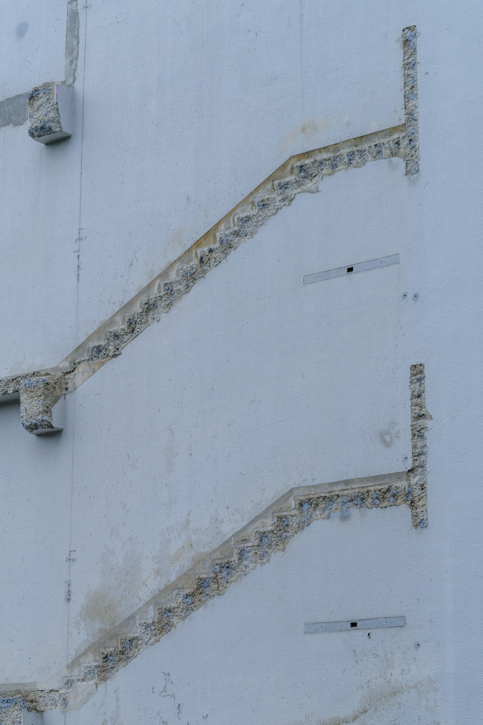 Decorative staircase design on a blue wall