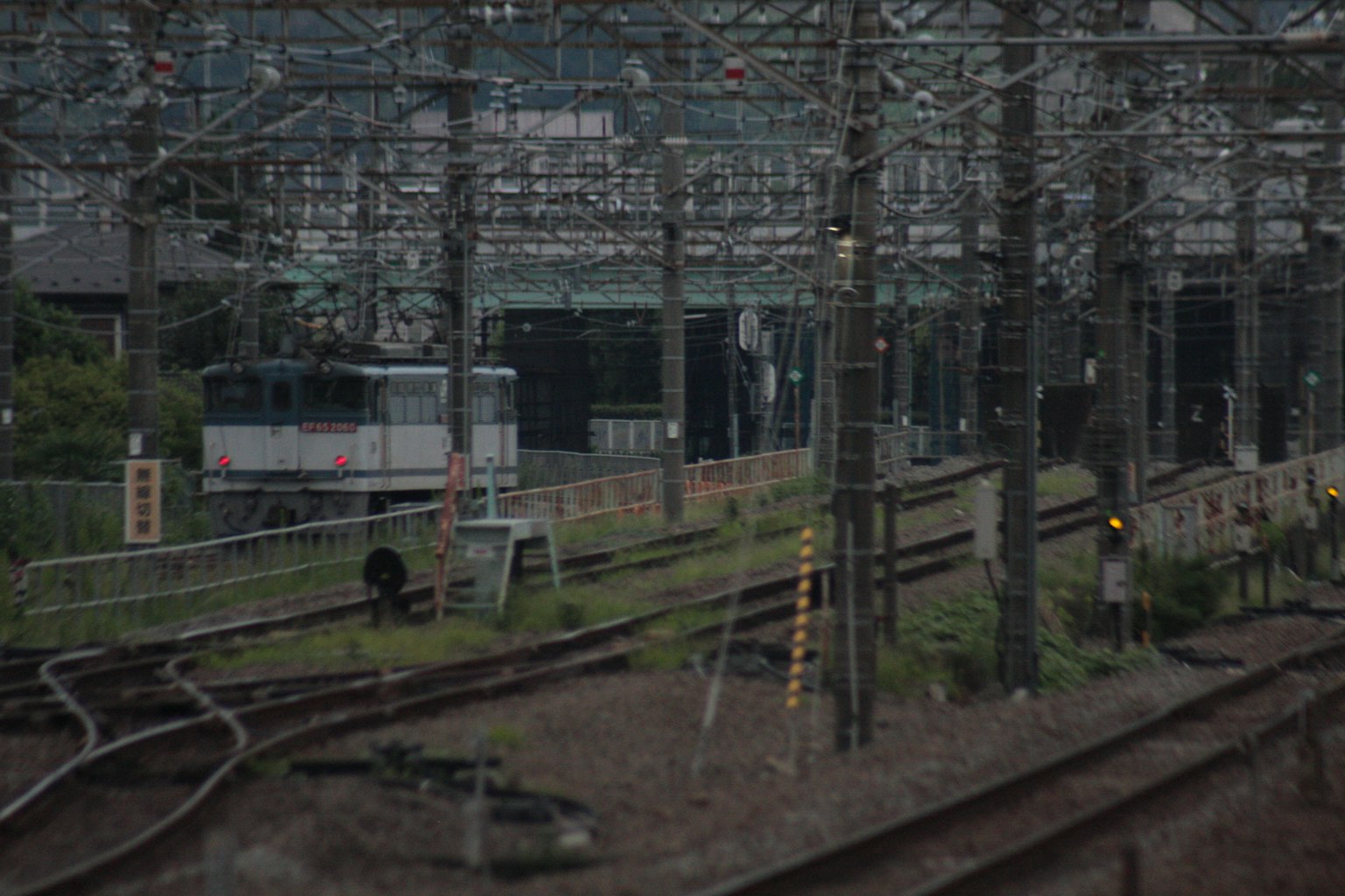 View of railway tracks with surrounding power poles