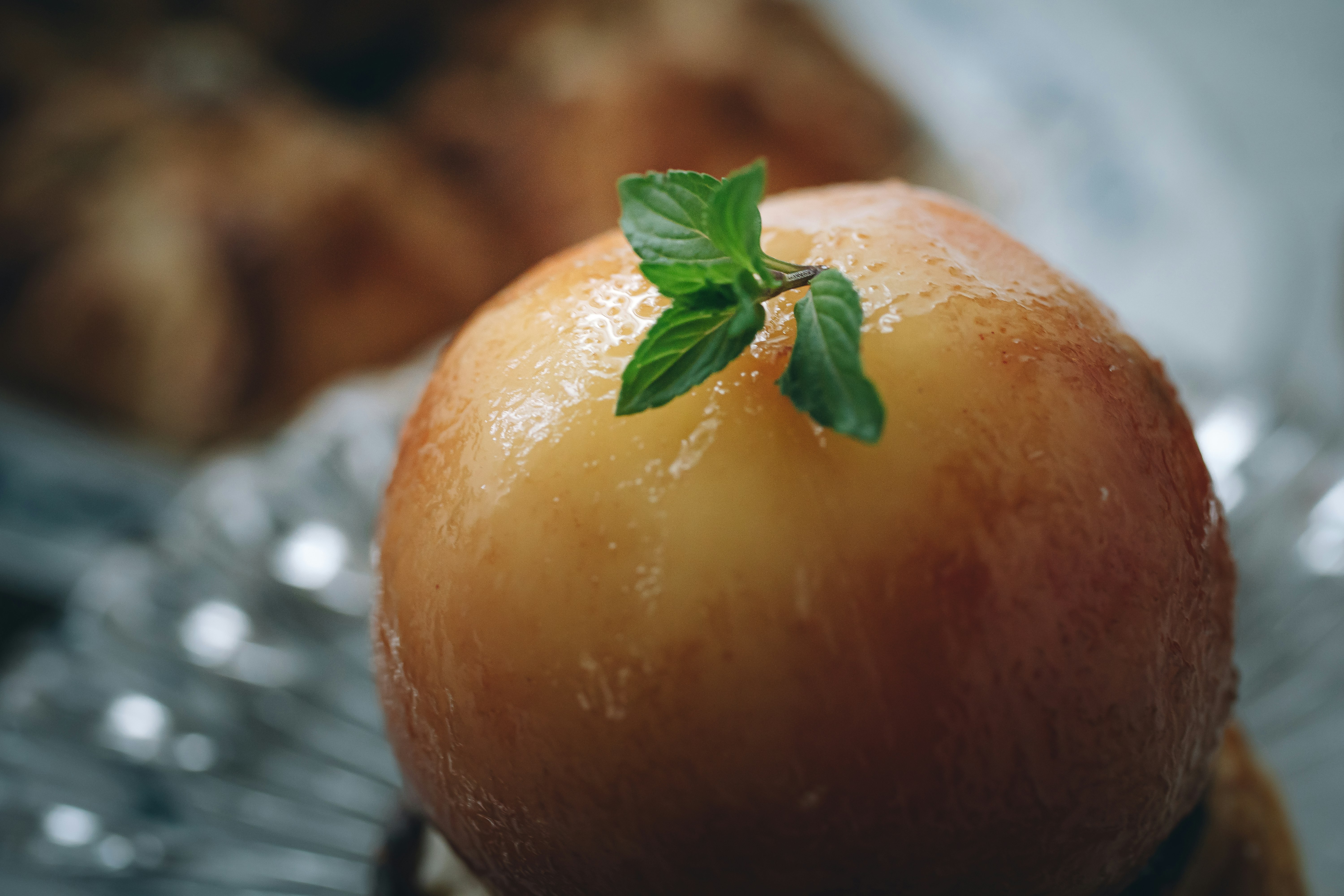 bowl of melon-like fruit with fresh mint garnish