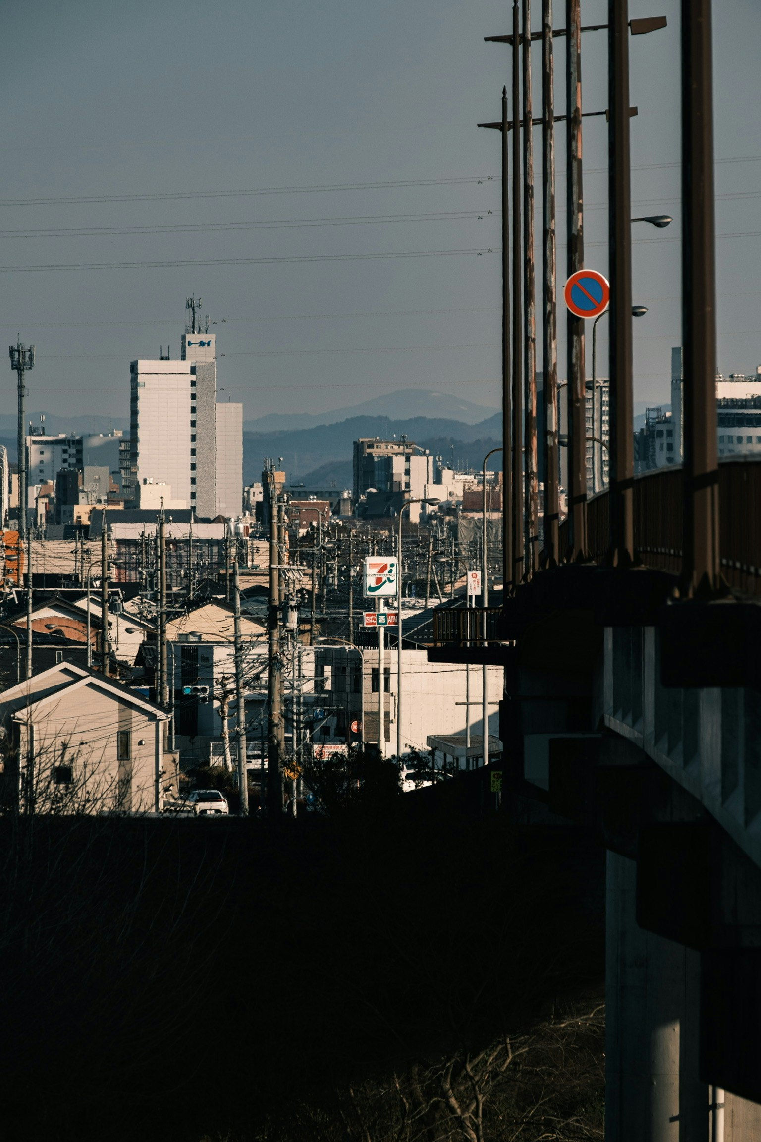 city skyline view over rooftops and utility poles