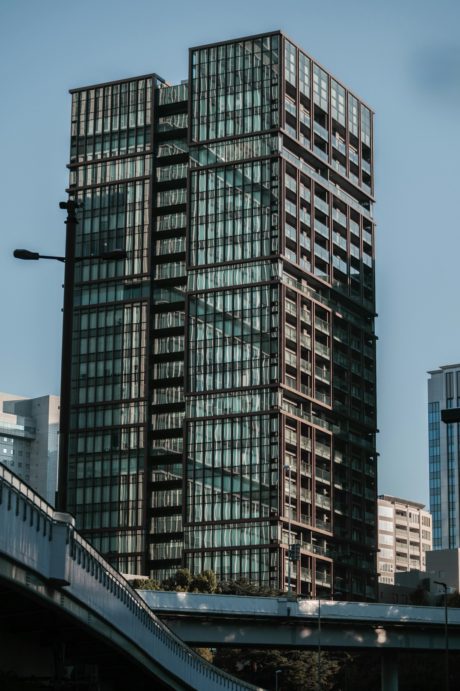 Modern skyscraper exterior featuring steel and glass structure urban landscape