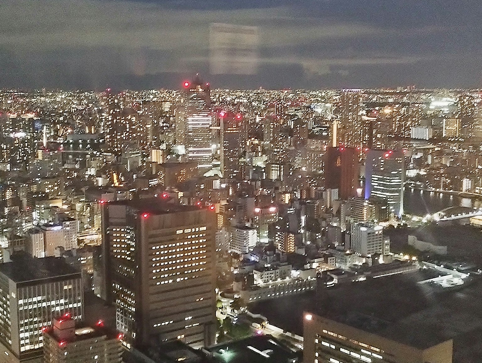 Night cityscape with a sea of lights and high-rise buildings
