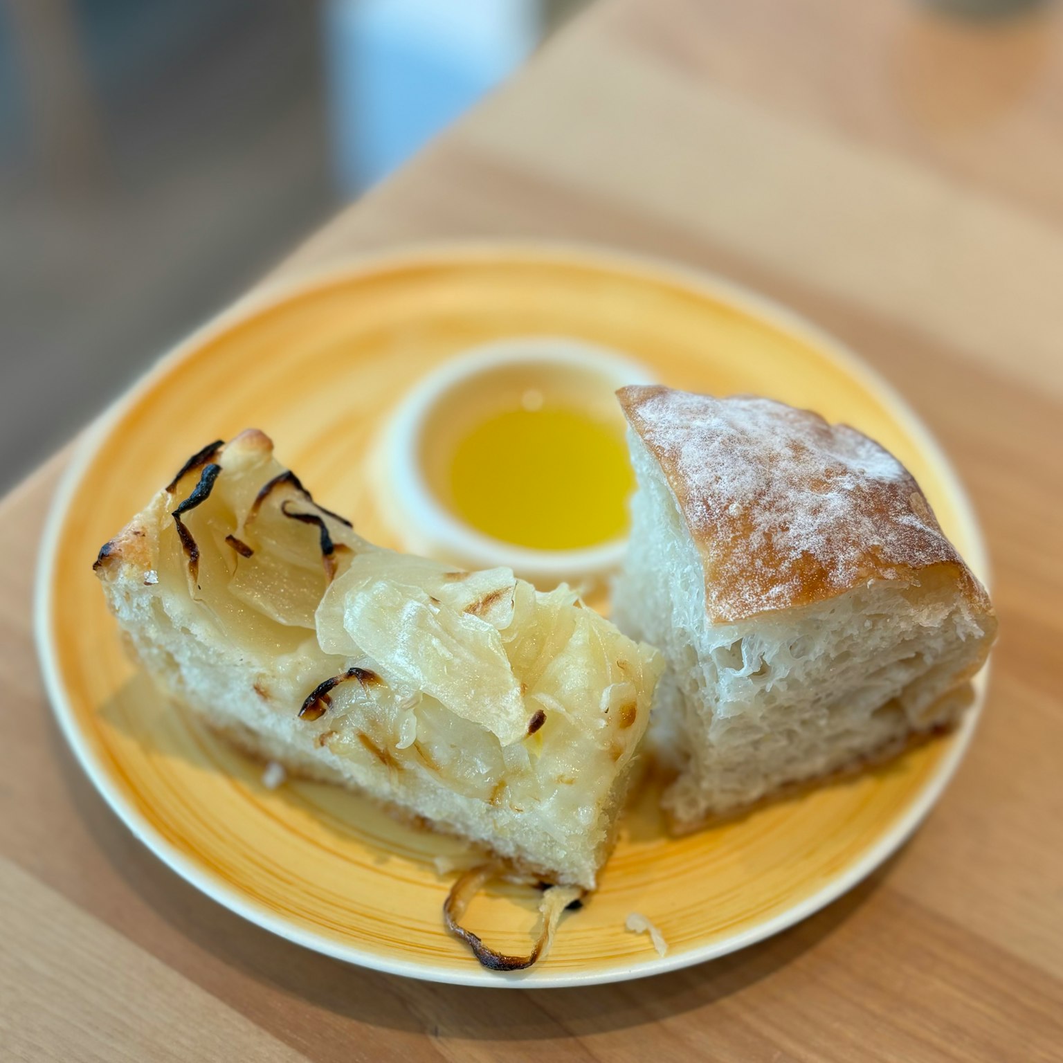 Freshly baked bread served with olive oil dip