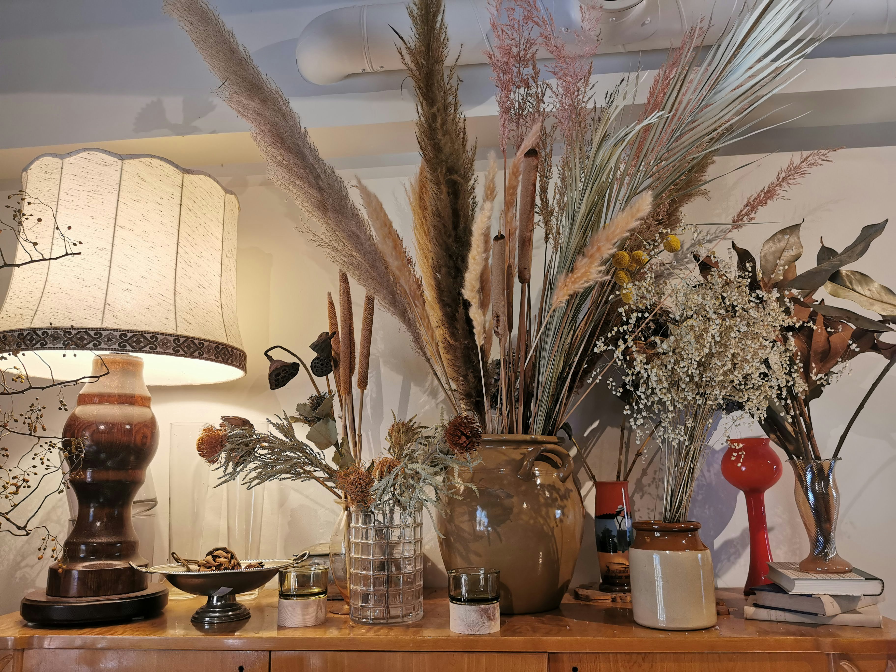 Indoor shelf decor with dried flowers and vases