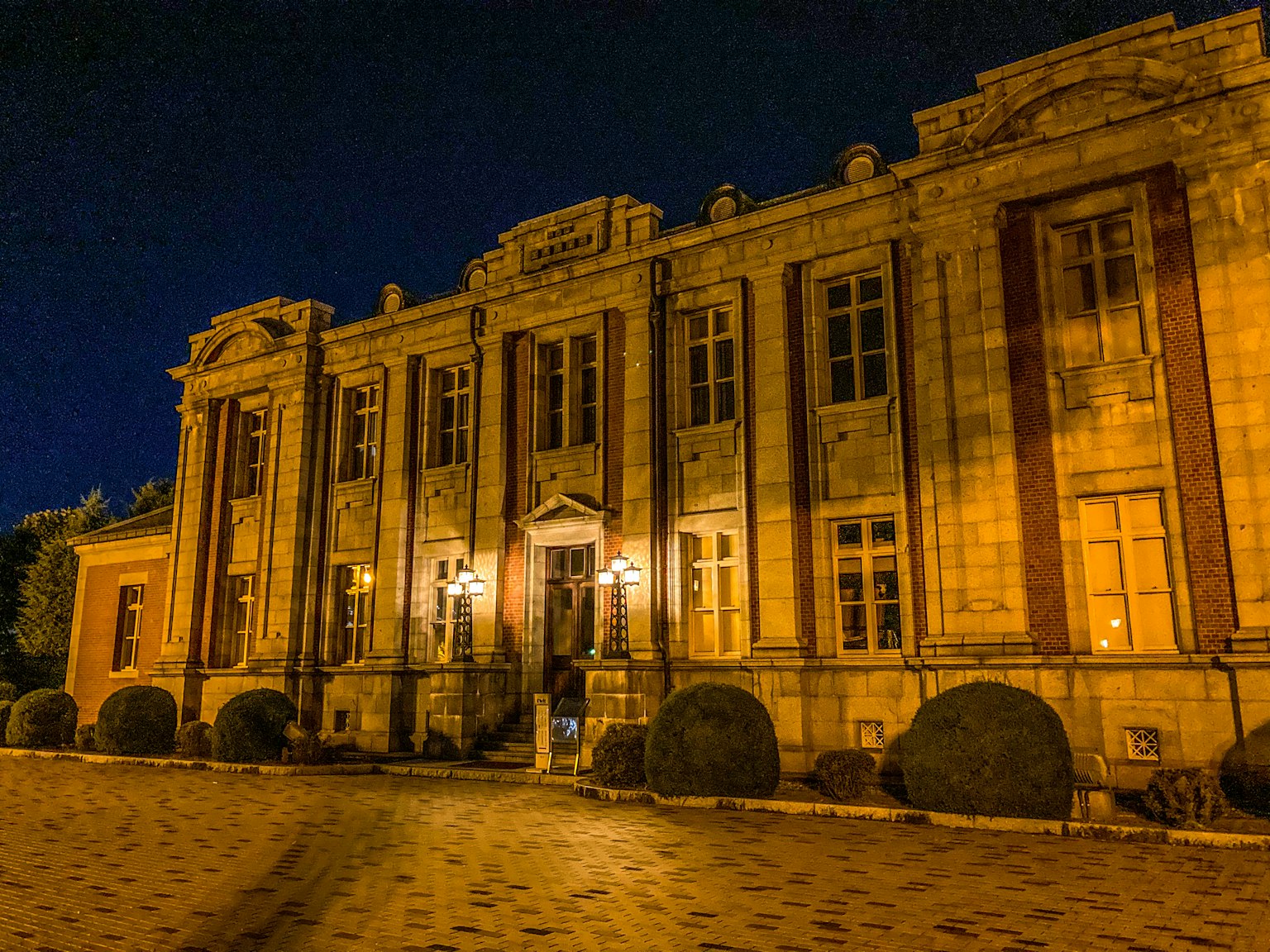 Exterior of a historic building illuminated at night