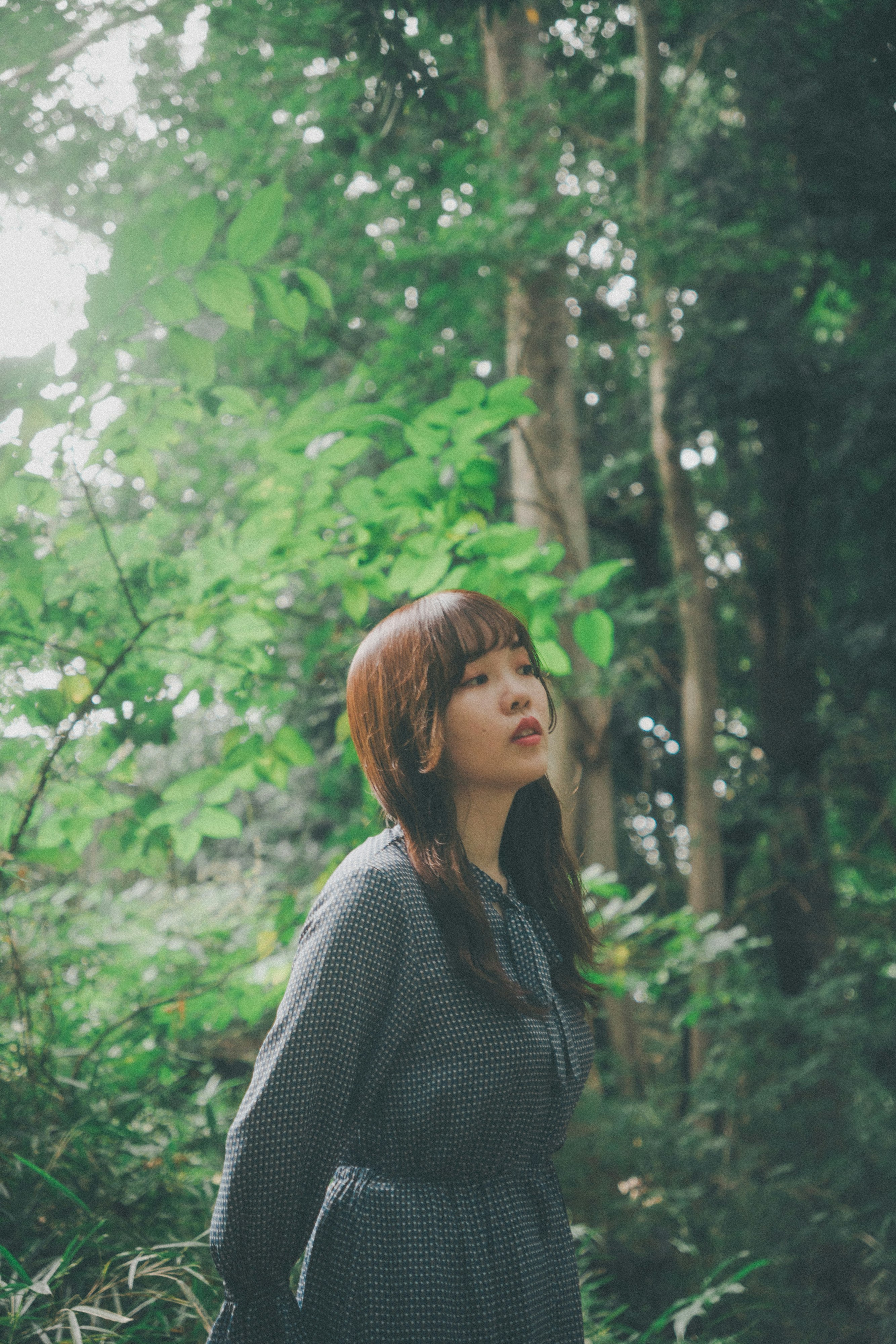 woman smiling in a forest