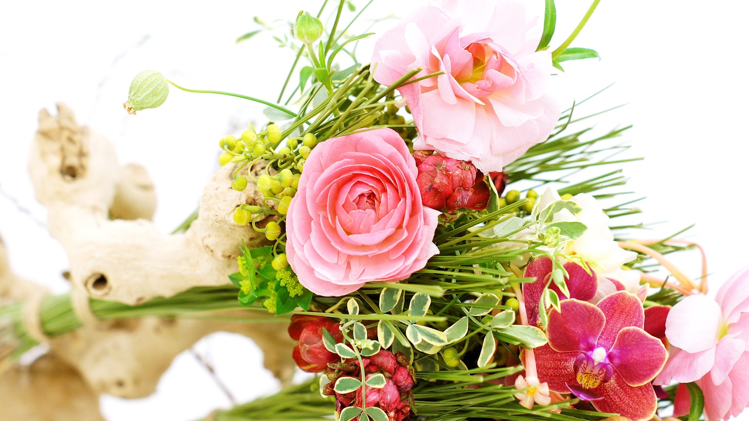 Close-up of a bouquet featuring various colorful flowers
