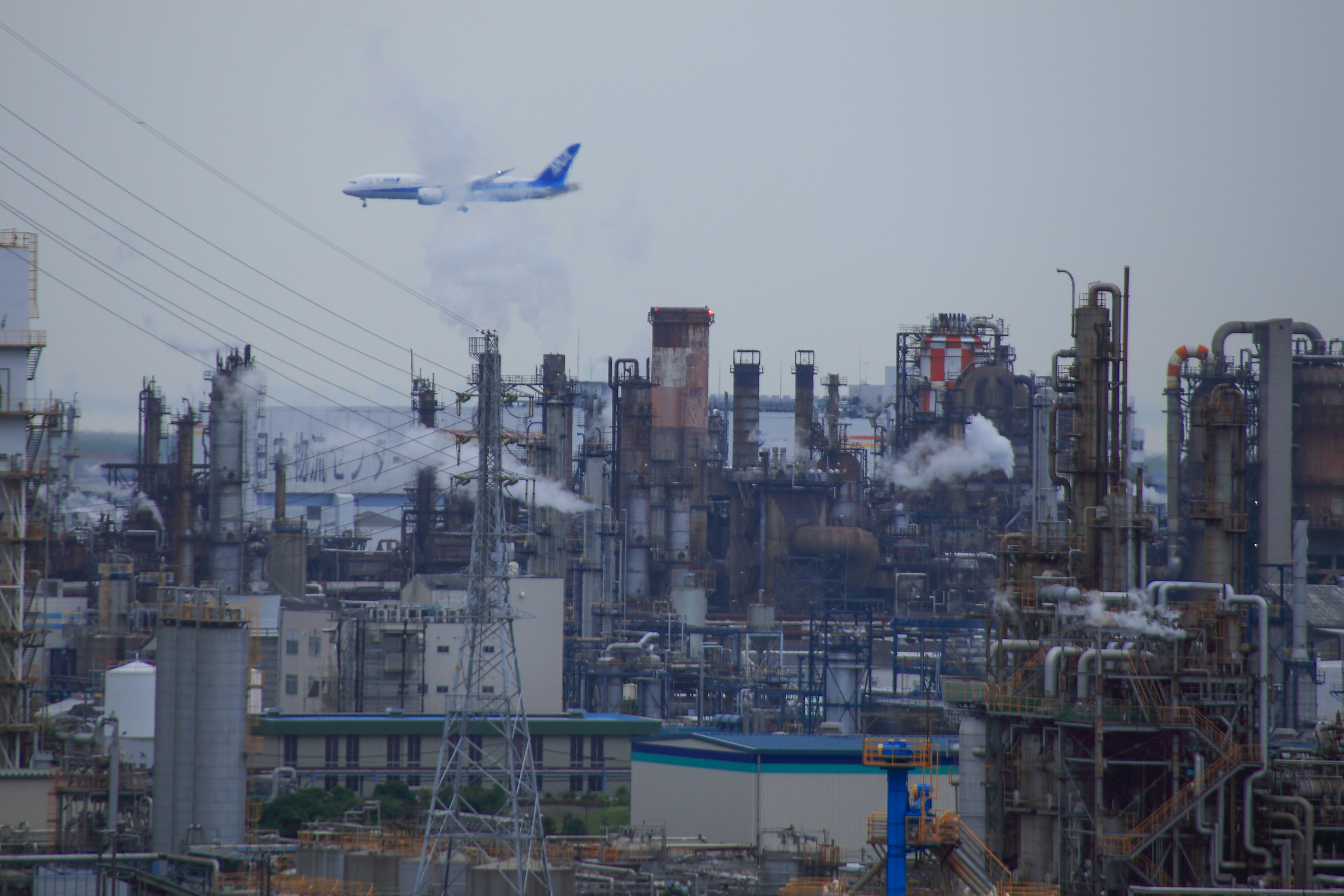 industrial plant landscape with smokestacks and pipework