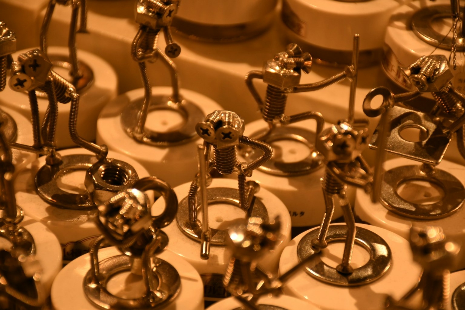 Image of small metallic figures arranged in various poses