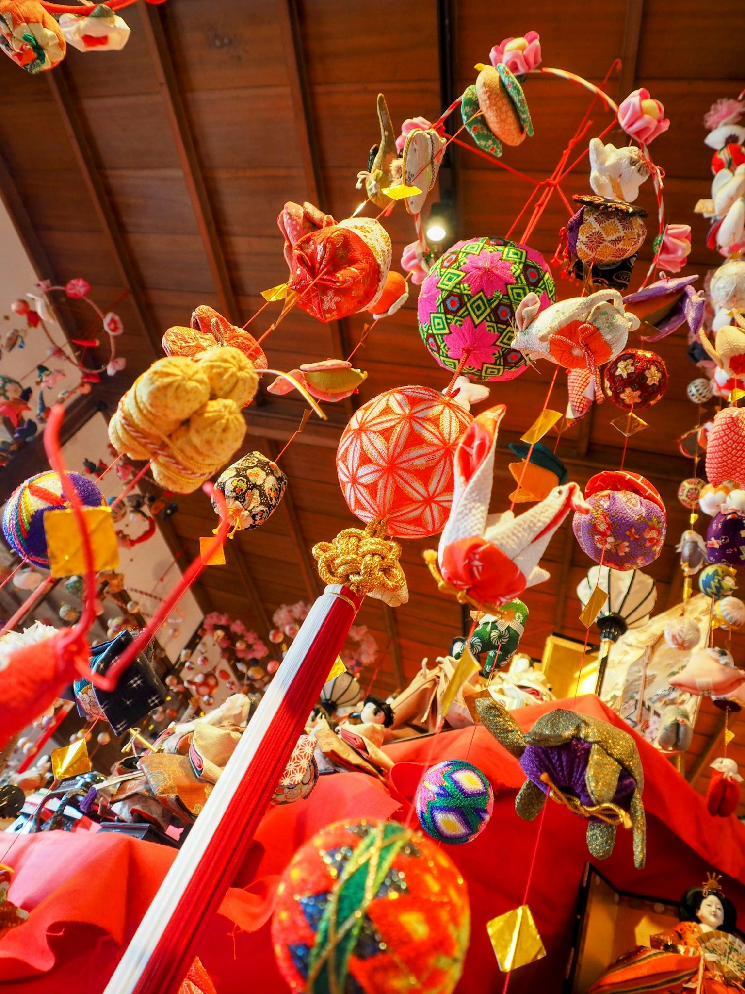 Colorful traditional Japanese hanging decorations suspended from the ceiling