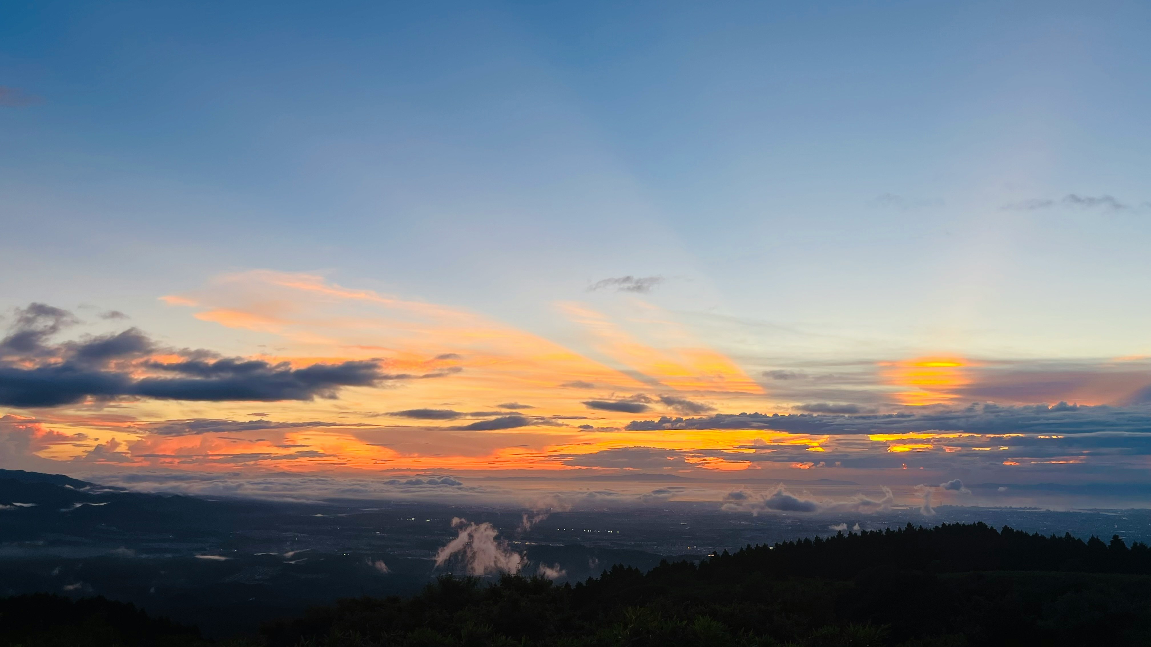sunset sky over mountain ridges