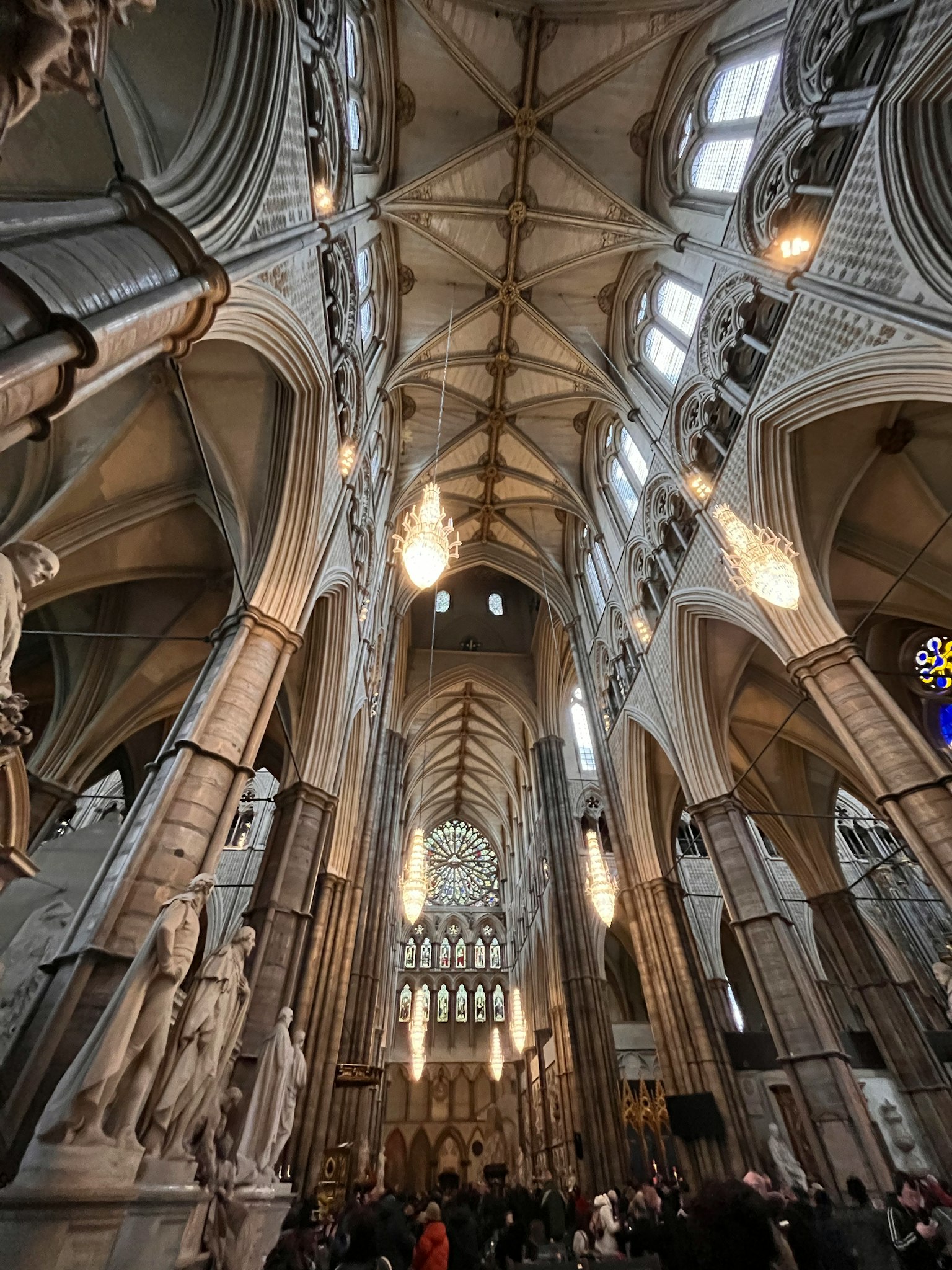 Interior view of Westminster Abbey showcasing the grand ceiling and intricately carved columns