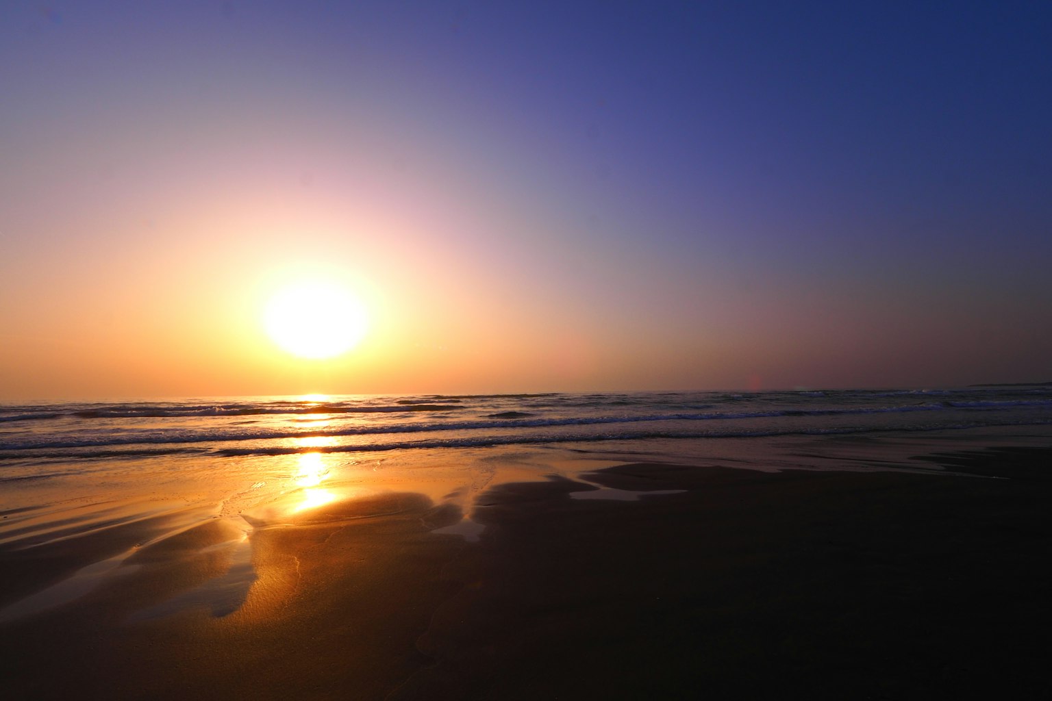Beautiful sunset over the ocean with waves