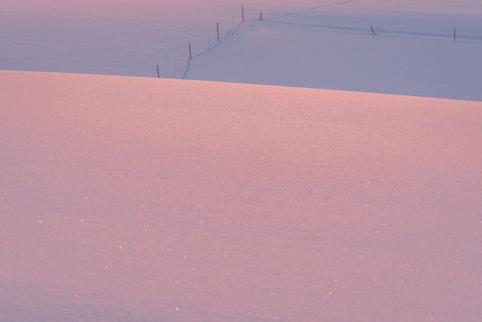 Soft pastel colors of a snow-covered landscape with gentle curves