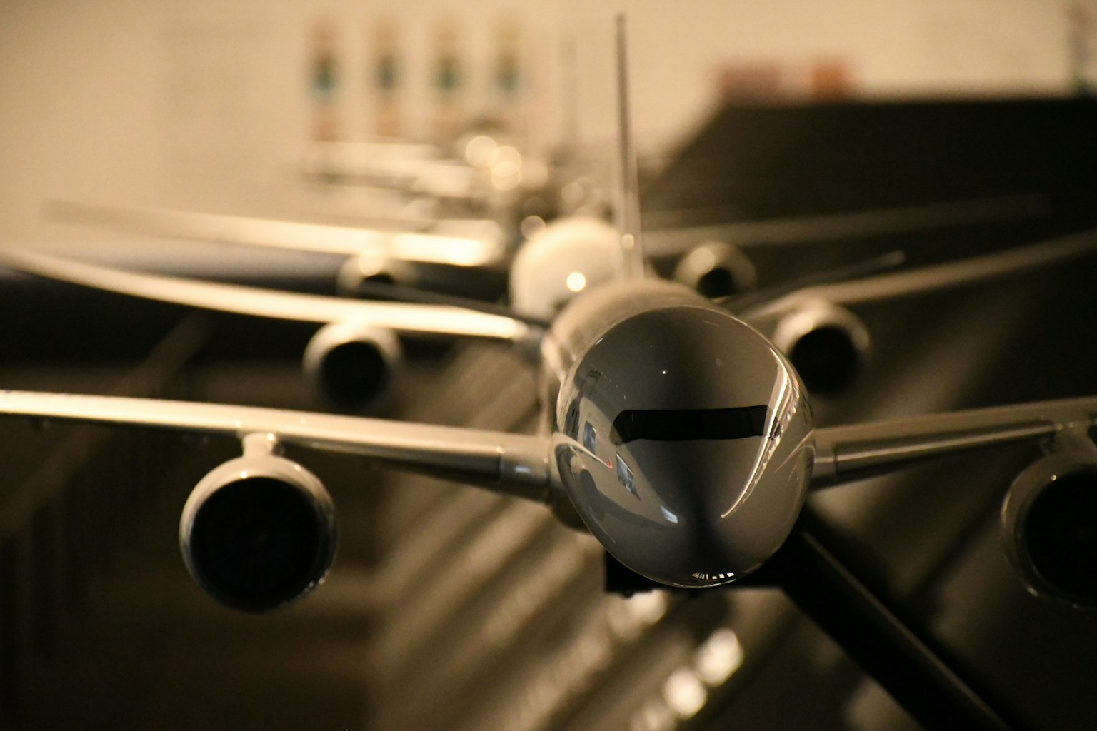 Close-up of airplane models lined up in a display room