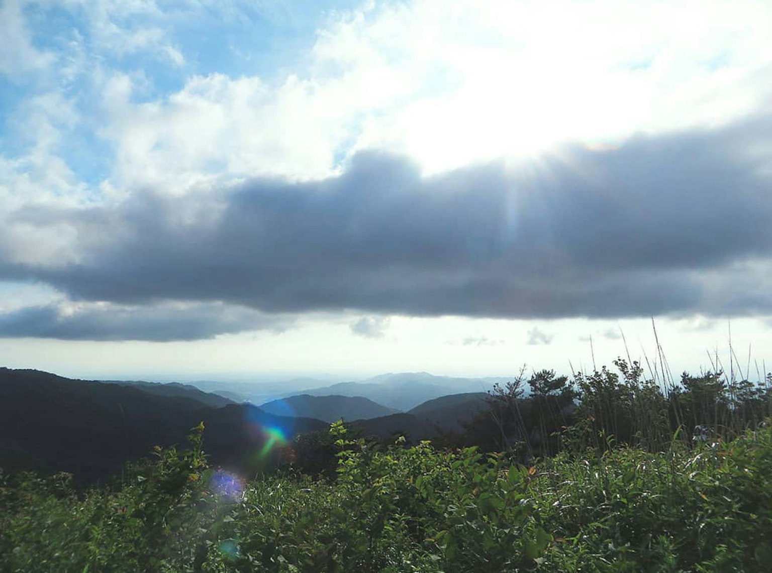 Landscape of mountains under a blue sky and clouds